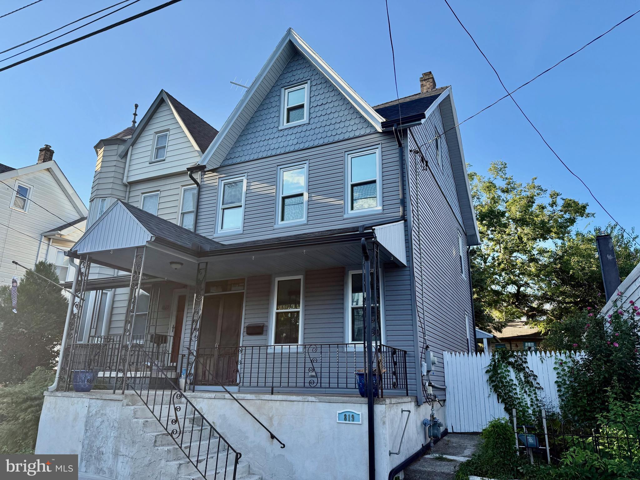 Welcome to 819 Spring Garden St! This four bedroom home still showcases some of its original charm combined with tasteful updates and upgrades. Starting with the exterior, this home has been restyled with newer siding/windows all around and topped with an updated roof. The three car garage in the rear also has been updated with a newer roof. The private back yard is great for pets, family and entertaining and includes a White Linden tree on the Historic Register! The rear patio also features a retractable awning. Moving on to the interior, you enter the home through a classic double door and welcoming foyer. Still original to the house, the foyer has an antique mirror and bench that will stay with the home. The first floor traditional floor plan features a living room, dining room and large eat-in kitchen. Each room has built shelves/cabinets for plenty of storage. Upstairs on level two are three bedrooms and two full bath. The primary bedroom features a walk in closet and full upgraded bathroom. At the end of the hall is another full bath with laundry hookups. Finally, on the third floor is the fourth bedroom along with a sitting area and large storage area. Available for showings now!