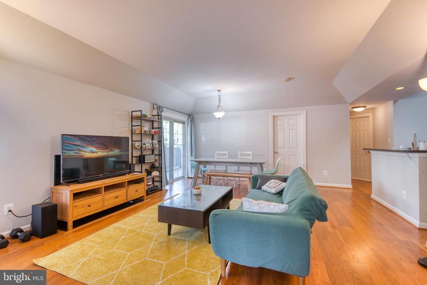 Spacious 2 bedroom 2 full bathroom condo featuring hard surface floors throughout the home in the Penderbrook Golf Course Community with water, trash, sewer utilities INCLUDED in the monthly rent! Available August 1, 2024. Main level entry means no stairs to climb. Beautiful hard surface flooring (no carpets) in both bedrooms with abundant natural light. Updated full size washer and dryer in-unit.  Updated refrigerator and dishwasher. Large walk-in closet. Open concept kitchen / living room which include a fireplace. Walk-out door to large private patio. Plenty of parking including street parking. Great location minutes to restaurants, shops, entertainment, grocers, parks and more! Near West Ox Road, Fairfax County Parkway, Rt. 50, Rt. 66 & Rt. 29.