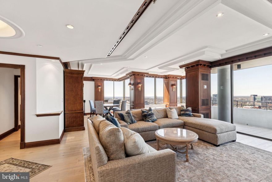 Stunning one bedroom, one and a half bathroom penthouse at the highly coveted Residences at The Rittenhouse Hotel. Enter the home through a welcoming foyer into a large great room beaming with natural light. Floor-to-ceiling windows and a spacious balcony offer breathtaking 270° sunset views to the west. The great room has handsome custom woodwork, a fireplace with mantle and rich wood built-ins. There is a generously sized, well-appointed kitchen with a window boasting see-forever views to the east, a Kohler double sink with disposal, wood cabinetry with under cabinet lighting, granite counter tops, decorative tile back splash, and a full lineup of high end appliances including a Sub-Zero refrigerator, Thermador double wall oven, GE Monogram electric stove top, Sub-Zero wine refrigerator, and Bosch dishwasher. There is a gorgeous hall powder room and a separate laundry room adjacent to the kitchen with a full-size Maytag washer and dryer. The primary suite has excellent closet space including a large walk-in closet and a wall of built-in closets, a second access point to the balcony, and an ensuite marble-appointed bathroom with double vanity, whirlpool soaking tub and seamless glass ThermaSol steam shower with 2 shower heads. Additional home highlights include brand new engineered European French oak hardwood floors throughout; all new TVs; state of the art surround sound and Sonos speakers in the living room, bedroom, and bathroom; fresh paint; recessed lighting; stunning moldings; and electric window shades throughout. The condominiums at The Rittenhouse sit atop the five-diamond Rittenhouse Hotel. Residents of The Rittenhouse enjoy the use of a chauffeur-driven town car, concierge, and 24-hour lobby attendant. And for an additional fee they can enjoy the same amenities as hotel guests, including valet parking, housekeeping services, room service, spa and fitness center, indoor pool, dog walking, the newly renovated Paul Labrecque Salon, and Lacroix Restaurant.