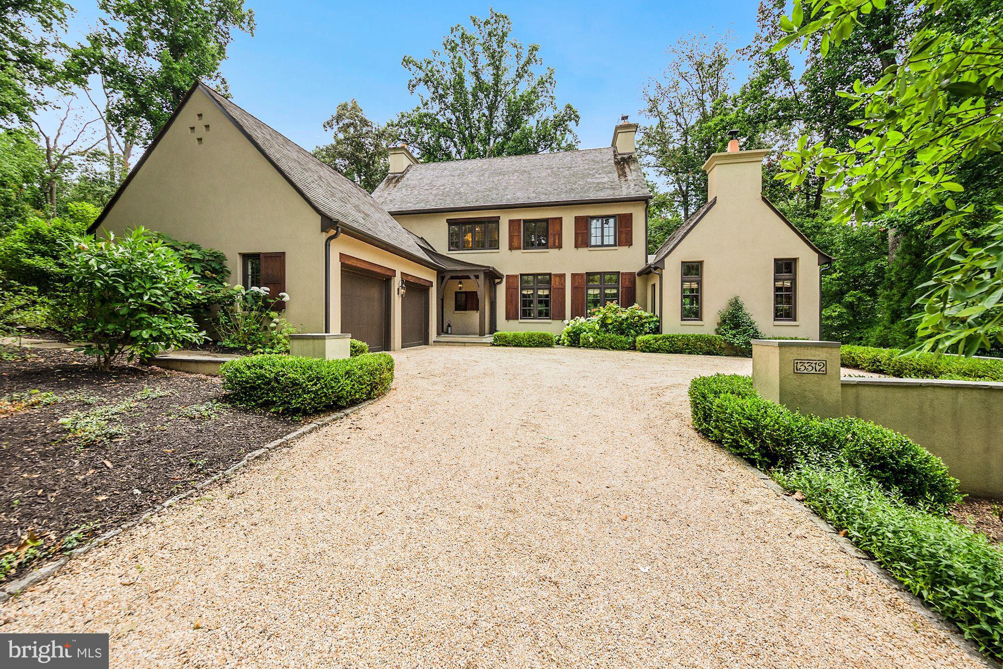 STUNNING DREW COTTAGE - One of the most beautiful homes in Merry Go Round Farm! Award-winning architect Jim Rill combines superior craftsmanship and functionality throughout this European country-style home in a woodland setting. Showcased in Bethesda Magazine, Drew Cottage features a couture kitchen replete with atrium breakfast room and expansive pantry, five baths, four roomy bedrooms, two offices, an exercise room, 3-car garage, geothermal heating/air system, and spectacular indoor and outdoor entertaining spaces overlooking conservation land and miles of private hiking trails along the Potomac River. ARCHITECTURAL DETAILS: The home’s inviting flagstone foyer serves as an indoor breezeway between the front portico and rear terrace, before pouring into a great room graced with 10.5 foot-high mahogany beamed ceilings, limestone fireplace, and three sets of French doors sweeping onto a 40 foot terrace perched over a private wooded back yard. The red oak paneled library has a cathedral ceiling flanked by built-in bookcases and window seats. Both the great room and library have Rumford fireplaces with gas-ready pilots and carved limestone mantels. The living area is open to the dining area, perfect for entertaining and informal living. The gourmet kitchen has custom cabinets, 2-inch-Carrera marble countertops, Thermador appliances, Freedom Induction cooktop, double ovens, prep sink, and dishwasher. The breakfast room is filled with sunshine streaming through floor-to-ceiling windows with gorgeous views of the ponds and pastures of Merry Go Round Farm. The pantry, mud room, spacious laundry room, and elegant powder room complete the main level. Wide plank white oak flooring continues throughout the main and upper levels flooded with natural lighting. The master suite boasts French doors opening to a walkout balcony overlooking the private back yard, an expansive walk-in closet with center island and built-ins, and a spa-inspired marble bathroom with oversized marble shower and his and her vanities. The two additional upstairs bedrooms have beautiful casement windows and great lighting. The walkout lower level features a large den with marble wet bar, perfect for entertaining, children’s rec room, or in-law suite, as well as an exercise room and possible office or additional guest room. The ample lower-level bedroom opens to a private loggia with beautiful views. A full bathroom, immaculate utility room, and multiple storage spaces complete the lower level. Drew Cottage superior architectural features include French-inspired rounded corners on walls, arched doorways, pocket doors, casement windows and doors with clad exteriors, extra thick exterior walls and iron banisters. The home has a three-car garage, indoor and outdoor Sonos sound system and wireless security system. The exterior features authentic stucco (three coats), clay chimney pots, cedar roof, cedar shutters, gutter helmet on all gutters and wood-stained soffits. The extensive hardscape includes a sweeping terrace, mahogany ceiling front and rear covered porches, sweetheart sitting nook, flagstone and pea gravel entertaining patios, cedar pergola and lower-level loggia. You will not find a home that better blends the beauty of its interior with myriad outdoor living spaces. State-of-the-art technologies include a geothermal dual zone heating/air system plus hot water, a fire sprinkler system, water filtration and surge protection.