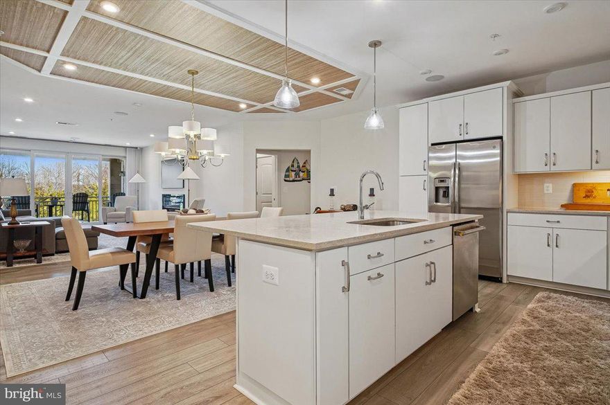 Welcome to 1000 Herons Nest Way, where you can live the good life at an great price.  This immaculate two bedroom condo, with two and a half baths and additional flex space, provides turn key convenience and resort style amenities.  This home is a MUST SEE!

This FORMER MODEL is like new and includes features that other condos won’t - including decorator upgrades, custom designed closets, plantation shutters, and a wireless sound system for multi-room audio streaming right from your phone or television.

Step inside to discover an open floor plan that connects space to create an inviting atmosphere for gatherings and everyday living. The large living room opens to a large balcony with EXCEPTIONAL PRIVACY that you won’t find in many other locations. With no buildings or homes behind yours, you can watch the sunrise while sipping morning coffee and enjoying views of nature.

The flex space has custom built ins that are great for displaying pictures and keepsakes. The flex space can adapt to your changing needs and could serve as an office, craft room, reading area, place to work out, or provide additional sleeping space.  All rooms feature luxury vinyl plank flooring, custom light fixtures, and recessed lighting. 

The kitchen is equipped with upgraded appliances, a gas stove top, built in microwave, quartz counters, beautiful upgraded cabinetry with lighting, and an oversized kitchen island. 

The primary suite has a luxury owner's bath, two spacious closets upgraded by California Closets, and additional access to the balcony. The bright and airy 2nd bedroom has a unique designer accent wall, a full bath, and an additional walk-in closet. Windows in both bedrooms bring in lots of natural light and are upgraded with the clean look of plantation shutters. 

The separate laundry room is equipped with an oversized washer and dryer. Off the foyer is a half bath for family and guests. This home also has a garage and an additional storage room on the first floor. The condo has a desirable second floor location, near the elevator, and steps from the building’s furnished "Club Room" which provides quiet space to relax, read, or meet with friends.

The HOA includes building maintenance, repairs, and access to all that Four Seasons has to offer - you can enjoy the activities worry free. The recent surge in utility pricing is less of a concern here, as the owner’s combined gas and electric bills over the past 12 months has averaged about $140. Water and sewer is included in the condo HOA. This may be a separate  charge at other locations.

There is something for everyone in this community.  Fantastic amenities include an amazing clubhouse with an indoor pool and hot tub, fitness center, library, and game room. Outdoors you find a riverside infinity pool, gas fire pits, tiki bar equipped with refrigerators, sinks and television monitors, pier with transient boat slips, walking paths that link to the Cross Island Trail, pickleball & tennis courts, bocce, dog park, and an outdoor amphitheater for live music and movie nights.

You can also enjoy daily activities such as yoga, exercise classes and clubs for biking, billiards, books, baking, cards, mahjong, and more. This unit is just a short walk to community kayak racks with launch access. The owner paid for the kayak rental space for 2026.