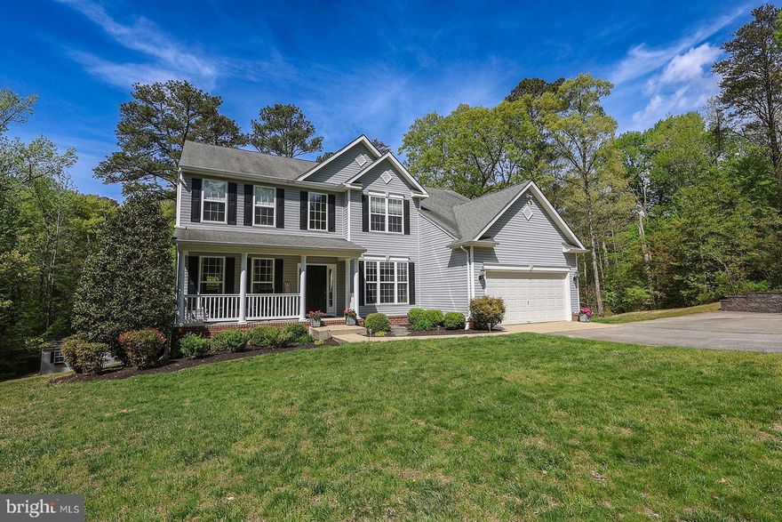 Beautiful colonial situated on a 4.12 acre secluded lot backing to 28 acres of Forest Conservation area!  This home has it all including 4 bedrooms, 3 1/2 bathrooms, finished basement with kitchen and more.  As you enter the foyer the hardwood floors lead you to a den/office perfect for working from home and extra space.  The kitchen includes upgraded stainless appliances, a breakfast area, and sliders leading to the deck and screened porch.  The screened porch is a perfect spot to relax and enjoy the sounds of nature...grab your coffee or evening cocktail and take a break from the world!  Family room with wood floors off kitchen with a gas fireplace.  The primary bedroom has vaulted ceilings, sitting area and walk in closets.  The primary bath has dual sinks, a large soaking tub, and separate shower.  3 additional bedrooms, a full bathroom complete the upper level.  Just when you thought you were done, the finished basement won't disappoint!  The walk out basement is finished and includes an exercise area, rec room, full kitchen, additional room that could be used as a guest area or flex space and a full bathroom.  Great potential for grown children in college, or in law suite, let your imagination run wild.  The basement sliders open to a patio and access to the back yard with storage shed.  Easy access to Route 235 for those travelling north and south or commuting to the base.  Close to schools, shopping and area amenities.  Schedule your online appointment today.