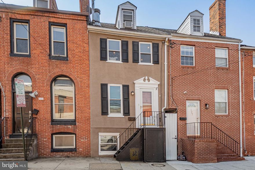 Welcome home to 129 East Cross Street! Nestled in the vibrant and sought-after neighborhood of Federal Hill. This inviting 2-bedroom, 2-bathroom home offers an ideal blend of urban convenience and cozy living. This charming home features hardwood floors on the main level, freshly painted walls throughout, & new carpet for the upper levels, creating a warm and welcoming atmosphere. The eat-in kitchen is perfect for casual dining and cooking, while the first-floor bathroom provides added convenience. Continue outside to your private, fenced-in backyard—an excellent space for entertaining, hobbies, or unwinding in peace amidst the city. The basement offers plenty of storage space for bicycles, seasonal items, or anything you need to keep easily accessible. Enjoy peace of mind with a updated roof (replaced in 2023) backed by a 50-year warranty, a updated HVAC system installed in 2024, a updated furnace in 2023, and a updated water heater in 2019. Experience the exceptional convenience of all that Baltimore has to offer, including local shops, restaurants, parks, and amenities. Don’t miss this opportunity to live in one of Baltimore's most desirable neighborhoods! OFFER DEADLINE - Monday, March 10th at 12pm