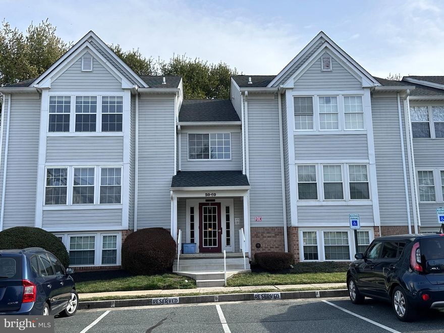 56 Jumpers Circle is a lovely condo located in Red Fox Farms.  This 1 BR/1BA condo  offers 820 sq.ft. of living space to include a den/office, open floor plan, kitchen with stainless steel appliances and a breakfast bar, plush carpets, in unit full size washer and dryer and a serene balcony with a storage area.  This is a secure building with an intercom to the front door.  Close to shopping centers, institutions, and highways.