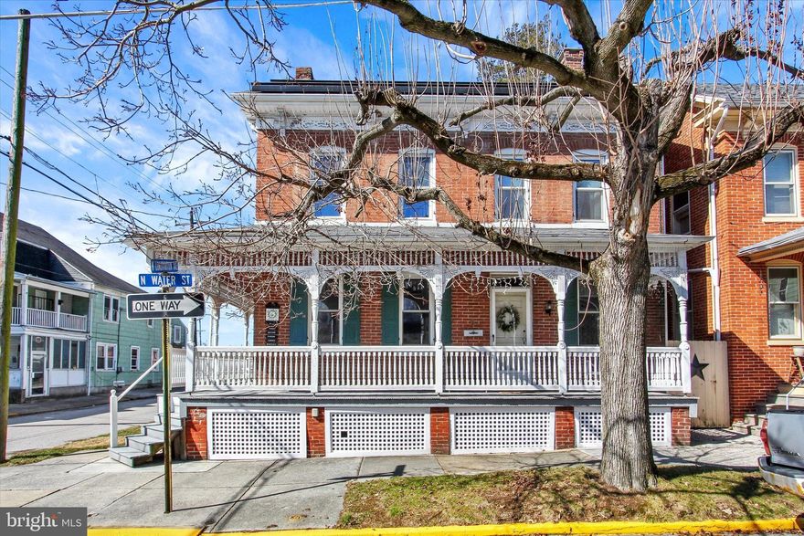Nestled in the charming Spring Grove Borough, this delightful Brick Colonial home, built in 1935, exudes warmth and character. Two full bathrooms.  Lots of updates and improvements! With 1700+ square feet of thoughtfully designed living space, this residence features four inviting bedrooms including one in the attic, and a full bathroom, perfect for creating cherished memories. Step inside to discover beautiful wood floors that flow throughout the home, enhancing its timeless appeal. The dining room sets the stage for gatherings, while the country-style kitchen is equipped with essential appliances, including a SS Refrigerator, electric oven/range, and a dishwasher, making daily living a breeze. Cozy up by the gas fireplace on chilly evenings, or enjoy the fresh air with the attic/house fan that keeps the home comfortable. Energy-efficient triple pane APPLEBY insulated replacement windows ensure a peaceful retreat. The full basement offers ample storage. Outside, the property boasts a generous 0.21-acre lot, complemented by a detached oversized garage / BARN with additional storage area, perfect for hobbies or extra vehicles. A charming 20 x 12 SUMMER HOUSE building adds to the property’s unique character and potential. This home is not just a place to live; it’s a sanctuary where comfort meets functionality. Experience the perfect blend of classic charm and modern convenience in this exceptional property. Washer / Dryer included.  Burnum Boiler new approximately 2000.  3 zone heating.  Wrap around porch.   Bath Fitters replacement tub.  Transom Windows.  Heated floors in large main floor Pantry / Laundry area with tiled floors.  Solar Panels -Full Warranty. $100 a month.  Saves approximately $1700-$2000 a year in electric costs.  Brand new bilco door.  Don’t miss the opportunity to make it your own!