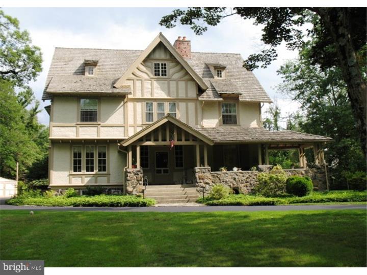 Welcome to this classic turn-of-the-century three story Tudor colonial home located along the route of the Devon Horse Show Carriage parade. Set well back from the road, there is plenty of room for the sport of your choice! Croquet anybody? The wrap-around covered porch is a charming place to relax, entertain or star gaze! A center entry room features the first of four brick fireplaces, high ceilings, tall wood wainscoting and pocket doors. Two classic parlors have corner fireplaces, large windows and views of the lawn. The library offers excellent shelf space for a fine collection. Enjoy entertaining friends in the spacious dining room. An old-fashioned wet bar boasts additional china and glass storage. The kitchen was completely renovated. There are hand crafted cherry cabinets, Corian counters, duel fuel Jenn Air stove, under-counter freezer, Kitchen Aid dishwasher, and instant hot water spigot plus a breakfast room. There is an adjoining laundry room plus a youth potty. The handsome wide staircase leads to a the mid-floor landing where you can rest on the window seat, then on to a second central hallway. A guest room overlooks the front yard and includes a full bathroom and classic porcelain bathtub. An out-of-use elevator shaft is in the corner. The master bedroom enjoys light from the Southern exposure. A great place to hear the birds singing in the morning. The renovated bath boasts a pedestal sink, ceramic tile shower and Pearl whirlpool. A large dressing room (or 7th bedroom) enjoys the fourth corner fireplace. Two additional bedrooms share a tile bathroom with stall shower. The third floor features a renovated hall bathroom that has a ceramic tile stall shower. Two generous sized bedrooms plus a large linen room and attic storage complete this level. The detached two-car garage has tool and bicycle storage in the adjacent work area Take note of the numerous architectural details that today's builders strive to achieve. Over two acres of mature trees and shrubs surround the home. Sellers are licensed real estate agents. Click on the camera icon for the virtual tour.