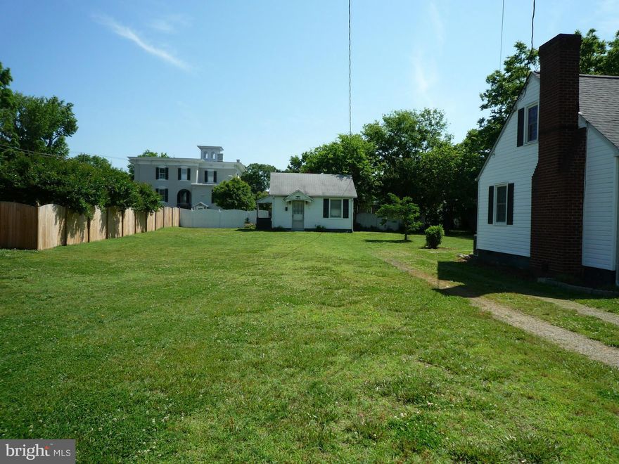 Lot located in Fredericksburg City with lots of potential!  Close to Route 1 & easy access to  I95. Near running trails and shopping. Located in a mature neighborhood and shares property line/fence with a very large high end home. Lot is cleared, flat & deep.  Includes driveway on right.  Small cottage in back w/ public water & sewer available. Building wired for electricity & sold AS IS.
