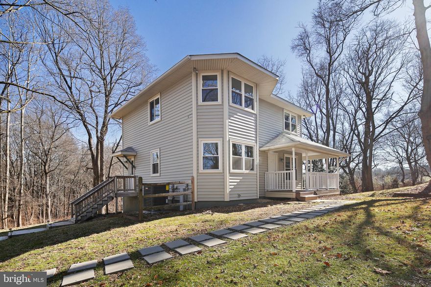 Looking for your perfect sanctuary? Indulge in relaxation on the wraparound front porch and soak up the breathtaking views. Set foot into your private hideaway, surrounded by the beauty of nature. Picture yourself enjoying the great outdoors, as you take in the ever-changing seasons - a pristine blanket of white during winter and a vibrant burst of colors in the spring. Tucked away on a generous three acres in Howard County, this property radiates a tranquil and alluring atmosphere, peace, and calmness. Despite being only a mile away from Rt 29 and I-70, this property remains a hidden gem, shielded from the hustle and bustle of everyday life. Step inside and be transported to a serene haven, where you can momentarily escape the nearby busy roads and bask in the joys of Howard County. The Seller has taken care of everything, just pick up the keys after settlement, and move right in.  All of this is convenient to shopping, restaurants, parks, schools, recreation, Olde Ellicott City, and all major commuter routes. Photos have been virtually staged. Please confirm schools with the county school board.