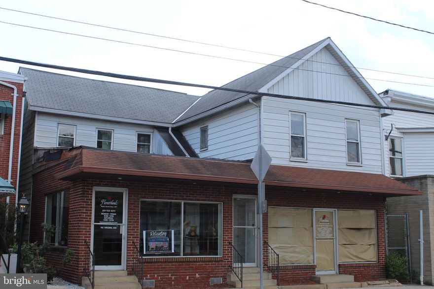 Great Opportunity.  Owner retired.
Excellent Business location.   Formerly, for many years,  this was a successful  flower shop serving   many loyal customers.   
Great exposure.,  Located on one of the highest traffic streets in Cumberland.    
This 2 story building is 6,820 square feet with over 20 rooms featuring 2 large show rooms, office areas, staging areas, several bathrooms, and a  18 foot walk-in cooler.
There is an enclosed/chained 2 car garage  located in the rear of the building.
To add value to this  purchase, it also includes 
 a 39x100 vacant lot located in rear of property at 111 Arch St.
The building size and  additional lot offers potential for many ventures.