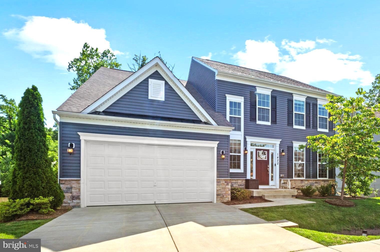 **Price Improvement** Welcome to 1422 Silver Oak Lane, a stunning stone-accented colonial in highly desirable Arnold Overlook! Built in 2019, this modern home is sure to check all the boxes, featuring 4,400 finished square feet of beautifully designed living space, 6 bedrooms and 4 full bathrooms. This home is truly turn-key, with major systems—including HVAC, appliances, roof, and windows—all only 6 years old. Step into the extended foyer, where luxurious hardwood-style flooring and soaring nine-foot ceilings set the stage for an inviting interior with tons of radiant natural light. The grand family room offers an inviting space for gathering, and flows effortlessly into the chef’s kitchen, boasting elegant shaker-style cabinetry, granite countertops, an eat-in breakfast bar, and Frigidaire® stainless steel appliance suite with a gas range. A dedicated dining room adds a formal touch, while a glass slider opens to a large elevated composite deck with peaceful treeline views.
The main level includes a private bedroom and full bath, perfect for guests or multi-generational living. Upstairs, four generously sized bedrooms and a full bath provide comfort and style, including a luxurious primary suite with an incredible walk-in closet, a soaking tub, dual vanities, and a glass-enclosed shower.
The expansive lower level continues to impress with nine-foot ceilings, full-length windows that flood the space with natural light, and a walkout to the grassy fenced-in backyard. A spacious and versatile rec room that features recessed lighting and a kitchenette is perfect for larger families, entertaining, a second family room, or a game room! You'll also find a dedicated 6th bedroom and 4th full bath with a sophisticated tile walk-in shower. A bonus room and a spacious extra storage locker completes this level. Located just 5 minutes from downtown Annapolis, this home is within walking distance of parks and Arnold Elementary School. Whether you're hosting, relaxing, or working from home, 1422 Silver Oak Ln blends comfort, convenience, and style—truly a rare find in the area!