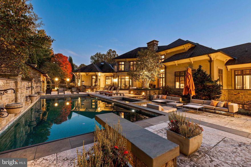 Live authentically. Experience this architectural marvel designed by Patrick Sutton. As featured in his book, "Storied Interiors, The Love of Travel, Patrick stated, "A home that has been shaped by a deep appreciation of life’s offerings and a passion to share them." A breathtaking piece of living sculpture.
Tucked away in a gated enclave, relish the quiet sense of arrival. A sensory celebration unfolds in the reveal. Cross the threshold and experience aesthetic richness like never before. The textures layered with bespoke lighting and curated architectural details create a symphony of artistry. A sense of openness pervades the space, soaring ceilings and sleek lines that captivate the eye. Sublime primary suite. The lower level is transcendent. Moroccan touches accent modern European sensibilities. Wine room, the ultimate art-deco theater, basketball court, dedicated guest suite and elevator access. The zenith of outdoor living awaits.
It's not just a dwelling; it's a work of art, a sanctuary, and a testament to the beauty of architectural innovation. Cultivate your existence. The art of uniting human and home.