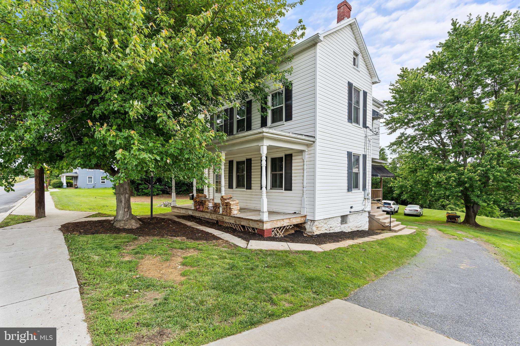 Professional photos coming Saturday!
Welcome home to 5 Main Street in the sweet town of Myersville! A commuters dream, this location provides both easy access to I70 with the allure of of small town living. The home sits on just shy of 3/4 acre lot with mountain views in all directions. Enjoy the views from the front or side porches, or perhaps from the patio out back. Come inside and see the large room sizes with hard wood floors through out. The first floor spaces include a large - recently redone- country kitchen with space for a dining table. The front of the home features the ample living room, as well as a secondary space that is perfect for a playroom, den or hobby space. The upper level of the home features 3 bedrooms with ample closets, and the bathroom with new flooring and vanity . Finish the bathroom to your taste. Storage is not a problem given the attic space and basement. In addition to storage, the basement also houses a dedicated laundry space with washer/dryer, AND is walk out level to that private back yard!
New HVAC was added to ensure the upper level stays nice and cool on warm summer evenings. Newer energy efficient windows and doors. Middletown Schools!