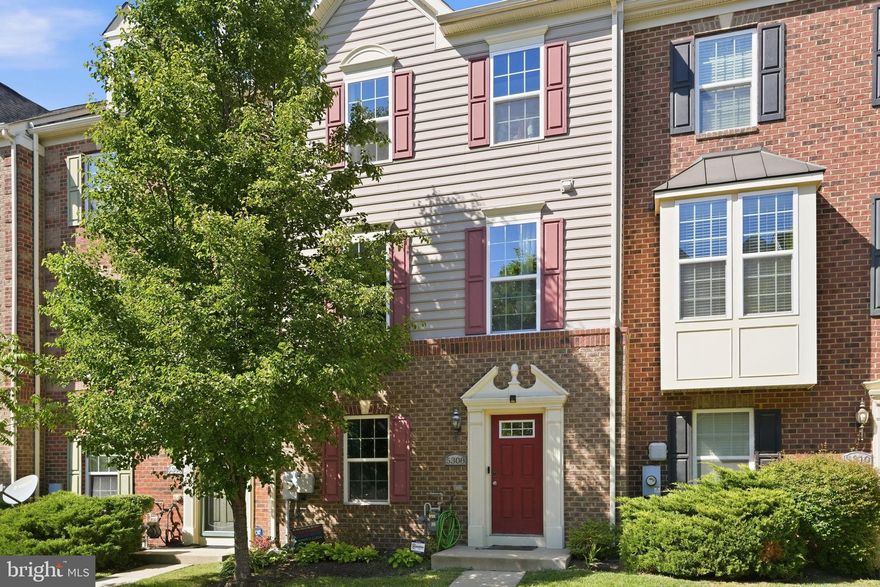Welcome to 5308 Davis Point Lane — a sophisticated four-level townhome in sought-after Greenbelt Station offering the perfect combination of luxury, flexibility, and modern living. With 4 spacious bedrooms, each featuring its own private en-suite bath, this exceptional home is designed for comfort, convenience, and style.  The entry level features a private bedroom suite with full en-suite bath, making it ideal for overnight guests, multigenerational living, or a quiet home office. The attached two-car garage provides added convenience and extra storage space.  The sun-drenched main living level boasts an open-concept design with gleaming hardwood floors, recessed lighting, and expansive living and dining spaces perfect for entertaining. The gourmet kitchen is the centerpiece of the home, showcasing granite countertops, an oversized center island with seating, sleek dark cabinetry, stainless steel appliances, and abundant cabinet and prep space. Large windows and glass doors fill the home with natural light and lead to a private balcony — the perfect spot to enjoy your morning coffee or unwind at the end of the day.  The third level offers primary suite with private en-suite bath, large soaking tub and shower, and large walk-in closet. The second generously sized bedroom suite, also has its own private bath.  Laundry room is conveniently situated in the main hallway.  The top level features a private fourth bedroom suite with en-suite bath and direct access to the spectacular rooftop deck, creating the ultimate indoor-outdoor retreat for relaxing or entertaining under the stars.  Ideally located near shopping, dining, parks, Greenbelt Metro, and major commuter routes, NASA and University of MD. UMD shuttle and Metro bus stops at Greenbelt Station Parkway and Greenbelt Road.