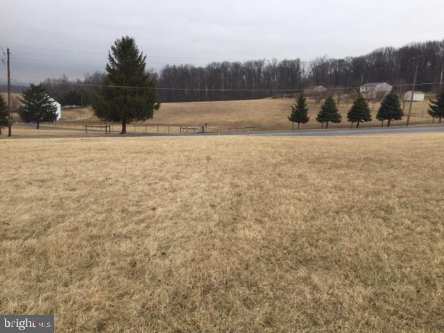 Spectacular views 1.2 acre building lot 10 minutes to Shrewsbury Exit 4 of I-83. White fencing on right side of property. Gently sloping for possible walk-out basement. Seller will have new perk & probe testing performed with acceptable offer. Lot #7 on plat.