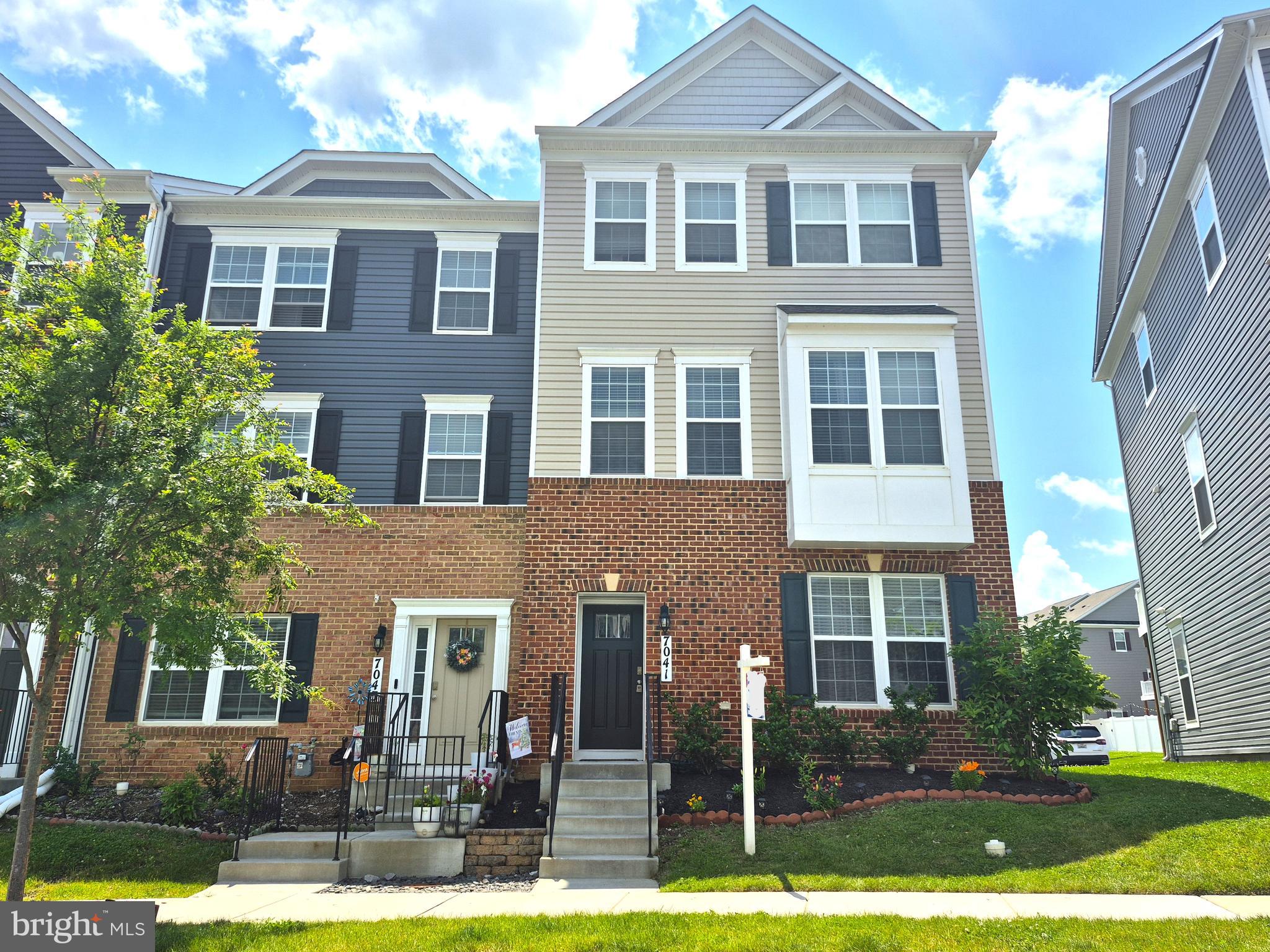 Welcome to 7041 Freedom Way – a stunning end-unit townhome offering three spacious levels of modern living in a prime Frederick location! Step inside to a bright entry-level flex space, perfect for a home office, gym, or additional living area, with direct access to a large 2-car garage and an extended driveway. The main level boasts an open-concept floor plan featuring a beautifully upgraded kitchen with stainless steel appliances, gas cooking, quartz countertops, and a large island – ideal for entertaining. Enjoy indoor-outdoor living with a deck right off the kitchen, and relax in the generous dining and living spaces with an abundance of natural light thanks to extra side windows. Upstairs, you'll find three well-appointed bedrooms, including a spacious primary suite with a luxurious en suite bath, two additional bedrooms, a full hallway bathroom, and the convenience of an upper-level laundry room. This end-unit townhome is ideally located with easy access to shopping, dining, and major commuter routes. Don’t miss this light-filled, move-in-ready home in a sought-after community – schedule your tour today!