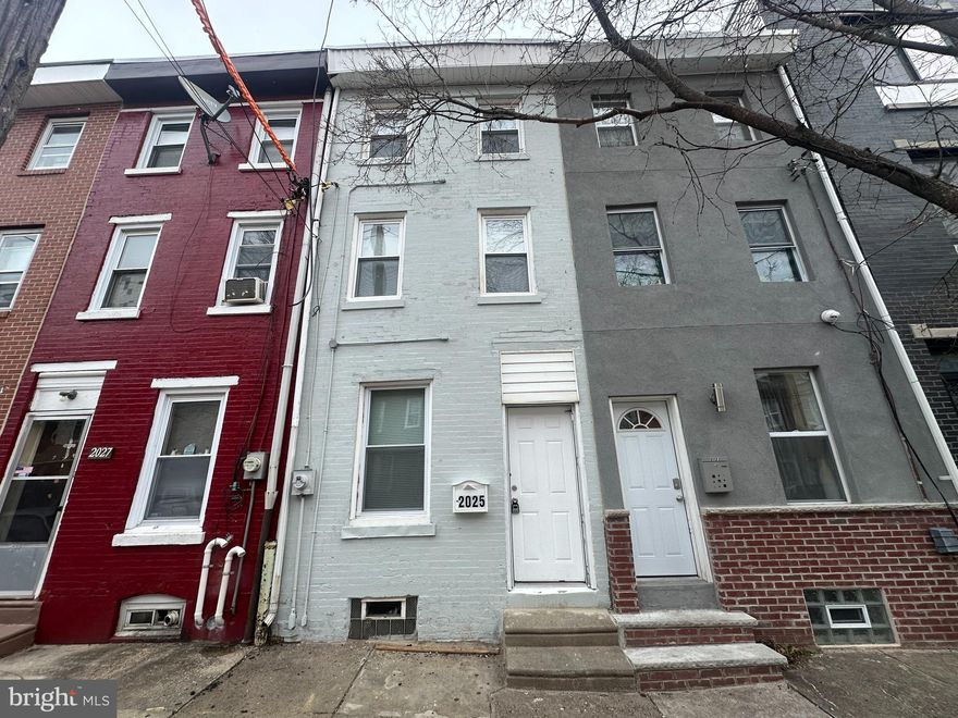 Welcome to a freshly updated, three-story row home nestled in the charming Norris Square neighborhood. Step inside to discover a welcoming main floor featuring laminate flooring that stretches seamlessly across the living and dining areas, creating a cohesive space for relaxation and entertainment.
It is followed by a fully remodeled kitchen, tailored to inspire your culinary adventures. It boasts white shaker cabinets, sleek quartz countertops, and a custom backsplash, all designed to make cooking a joy. Ascending to the second floor, you'll find an inviting bedroom alongside a lavishly updated bathroom complete with a tub and stylish wall tiling, offering a perfect retreat for unwinding after a long day. The journey continues to the third floor, where two additional bedrooms provide ample space for family, guests, or a home office—step outside to the fenced rear yard, a private enclave for morning coffees or weekend barbeques. Come take a look and unlock the door to your future home today.