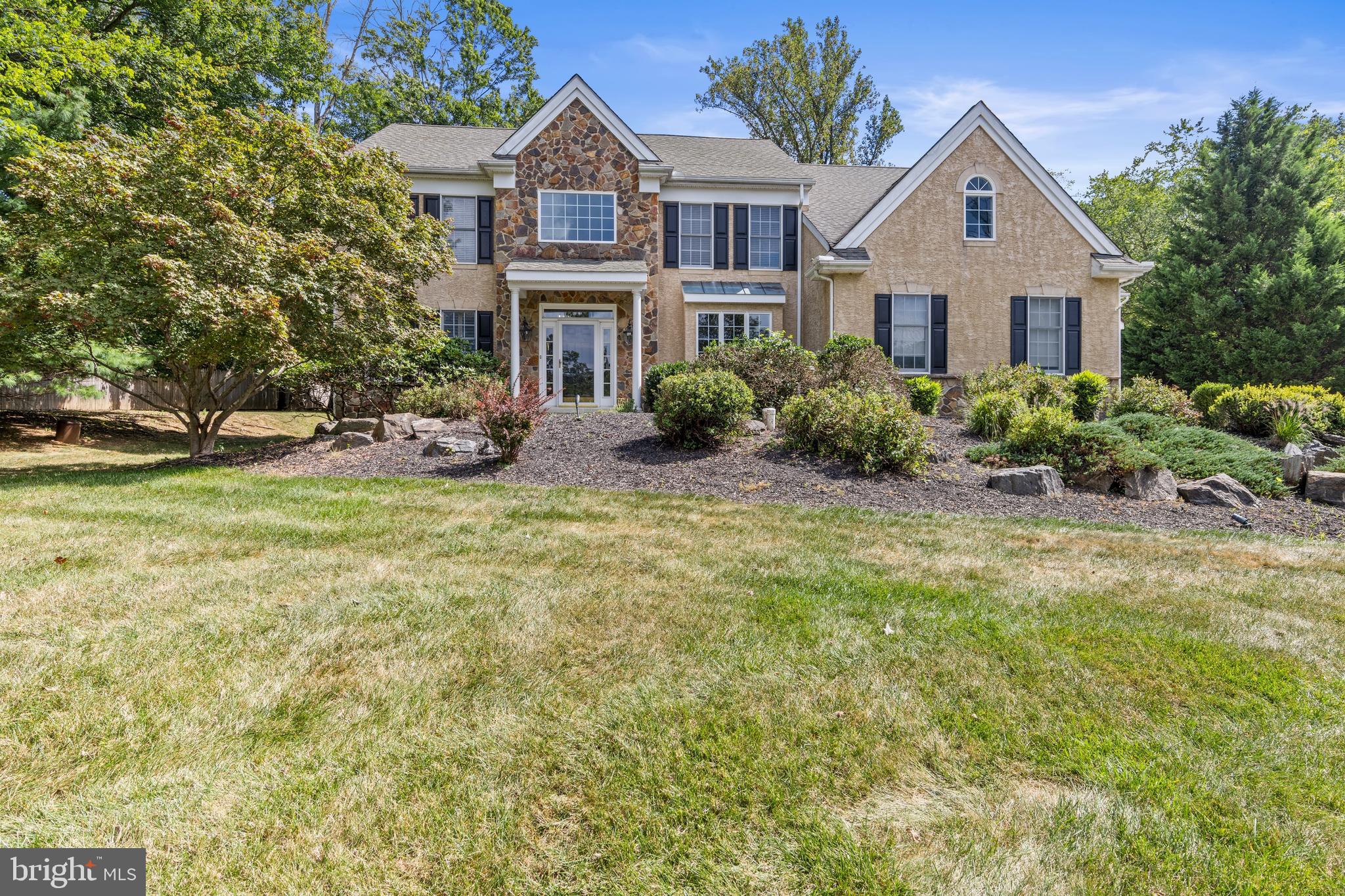 Welcome to this incredible home in the highly sought-after "Heilbron" neighborhood, located within the award-winning Rose Tree Media School District. Situated on a beautiful, long driveway, the house greets you with a meticulously manicured front yard and an inviting entrance.
Step inside and be captivated by a two-story foyer featuring a grand staircase. The first floor is designed for both elegant living and everyday comfort, with a formal study/office, a den with a coffered ceiling, and a powder room. The heart of the home is the stunning two-story family room, complete with a gas fireplace, that flows seamlessly into the gourmet kitchen and breakfast room. The kitchen is a chef's dream, featuring double wall ovens, a wine refrigerator, a large island with seating, granite countertops, and plenty of beautiful wood cabinets.
Off the kitchen, you'll find a well-organized mud room and a laundry room, providing direct interior access to both garages ( a two car garage and a one car garage which provides ample parking and storage)
The second floor offers a spacious primary bedroom with two walk-in closets and a recently updated en-suite bathroom. This luxurious retreat includes a walk-in shower, a separate jacuzzi tub, and a double vanity. Two additional updated full bathrooms and three more bedrooms complete this level.
A unique and valuable feature of this home is the separate two-story in-law/au pair suite. Accessible through beautiful French doors off the breakfast room, this private addition includes its own living room, a large upstairs bedroom and a full bathroom. A private balcony off the suite provides a peaceful spot to enjoy the fresh air.
The finished basement adds a versatile living space, perfect for entertaining and a dedicated area for gym equipment, and includes a full bathroom. Outside, the large rear yard features a new Trex deck, ideal for enjoying the outdoors.
Located close to local shops and a variety of restaurants, this home combines privacy with convenience. The property also boasts recent upgrades, including a new roof in 2019 and two new HVAC systems installed in 2025, ensuring comfort and peace of mind for years to come. Square footage is estimated.