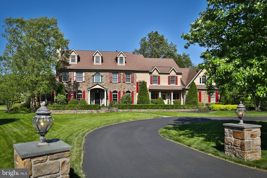 A Winding Drive with Lighted Stone Columns Welcomes you to this Custom-Built Maplewood Mike Evans Stone Front Colonial in highly sought after Ambler and the Award-Winning Hatboro-Horsham School District. Located on a quiet Cul-de-sac, this Magnificent 1.15 Acre Home features beautifully manicured mature Landscaping which graces the Slate Walkup to the front door of this inviting home. The Impressive Entry with Sidelights, Arched Transom and Hardwood Floors welcomes you into a Well-Appointed and Spacious Executive Residence showered in natural light by Palladium Windows, Soaring Ceilings, Dual Stairways, Four Fireplaces and detailed Millwork throughout. This Spacious Property showcases every amenity on one’s wish list:  Catering to Gourmet and Foodies alike, the Well Appointed Kitchen with Island and Tasteful Pendant Lighting, this Chef’s Kitchen boasts Custom Maple Cabinetry with alternating Glass Doors, Integrated Appliances, 5 Burner Cooktop, Tasteful Ceramic Tile Backsplash, Handsome Granite Countertops, Walk-In Pantry, Full Butler’s Pantry, and an Adjacent Breakfast Room with Gorgeous Backyard Views and French Doors that exit to the backyard Paved Walkway. The Laundry/Mud Room is conveniently located off the Kitchen, making daily chores so much more convenient. Our tour continues to the Great Room with 2 Story Ceilings, Marble surround Gas Fireplace and Plenty of Arched Windows, followed by the elegant Dining Room with Tray ceiling and Crown Moldings is perfect for holiday and family gatherings, followed by the Living Room with Marble framed Gas Fireplace and Crown Molding, a wonderful place to relax after that holiday meal. Tucked away with a Vaulted/Cathedral Ceiling, you will find the Sunlit Conservatory, a perfect place to enjoy a good book. If you’re working from Home, the Sizable Office is ideal. The Second Level invites you to your Primary Suite which provides all the luxuries of your favorite hotel in the comfort of your own Home. This Bedroom features Two Walk-In Closets, a Gas Fireplace for those Wintery and Fall Nights, a 5 Piece Bathroom with Double Maple Vanities, Rubbed Bronze Lighting, Large Frameless Glass Shower Stall with Neutral Tiles, an Adjacent Soaker Tub in addition to a Dressing Room. The Sitting Room provides plenty of possibilities as does the adjacent room which is currently used as a Study. The remainder of the Second-Floor hosts 3 Generous Sized Bedrooms with ample Closet Space; the Second and Third Bedroom share a Jack and Jill Style Bathroom and the Fourth Bedroom has its own Full Hall Jack and Jill Bathroom. Our tour continues to the Lower Level of this Spectacular Property; this area features: Media/Theater Room, Game/Rec Room with Gas Fireplace, Kitchen/Wet Bar, Fifth Bedroom, and Full Bathroom with New Shower. Perfect for an Au Pair In-Law Suite or Extended Family. The Lower Level has Egress to the Backyard, with Sliders exiting to the Two-Tiered Paver Patio, with pastural views of the Koi Pond, the perfect spot for your morning coffee or weekend backyard barbecue. A 4 Zone HVAC System will keep your home comfortable all year long. The Three Car Garage completes this home, providing shelter and plenty of storage for both cars, recreational equipment and room for your favorite hobbies or crafts. Added assets include; Huge Attic ready for Finishing, 220 Volt Receptacle for your Electric Vehicle, Fresh Paint, New Water Heater, New Ejector Pump, New Sump Pump, New Light Fixtures, Koi Pond, Retaining Stone Walls and Outdoor Sprinkler System to water your Lush Green Grass. Your Future Home is conveniently located with easy access to Route 309, PA Turnpike, Limekiln Pk, restaurants, shopping, parks, country clubs and Ambler Septa Train Station. 1 year warranty included to the fortunate Buyers.