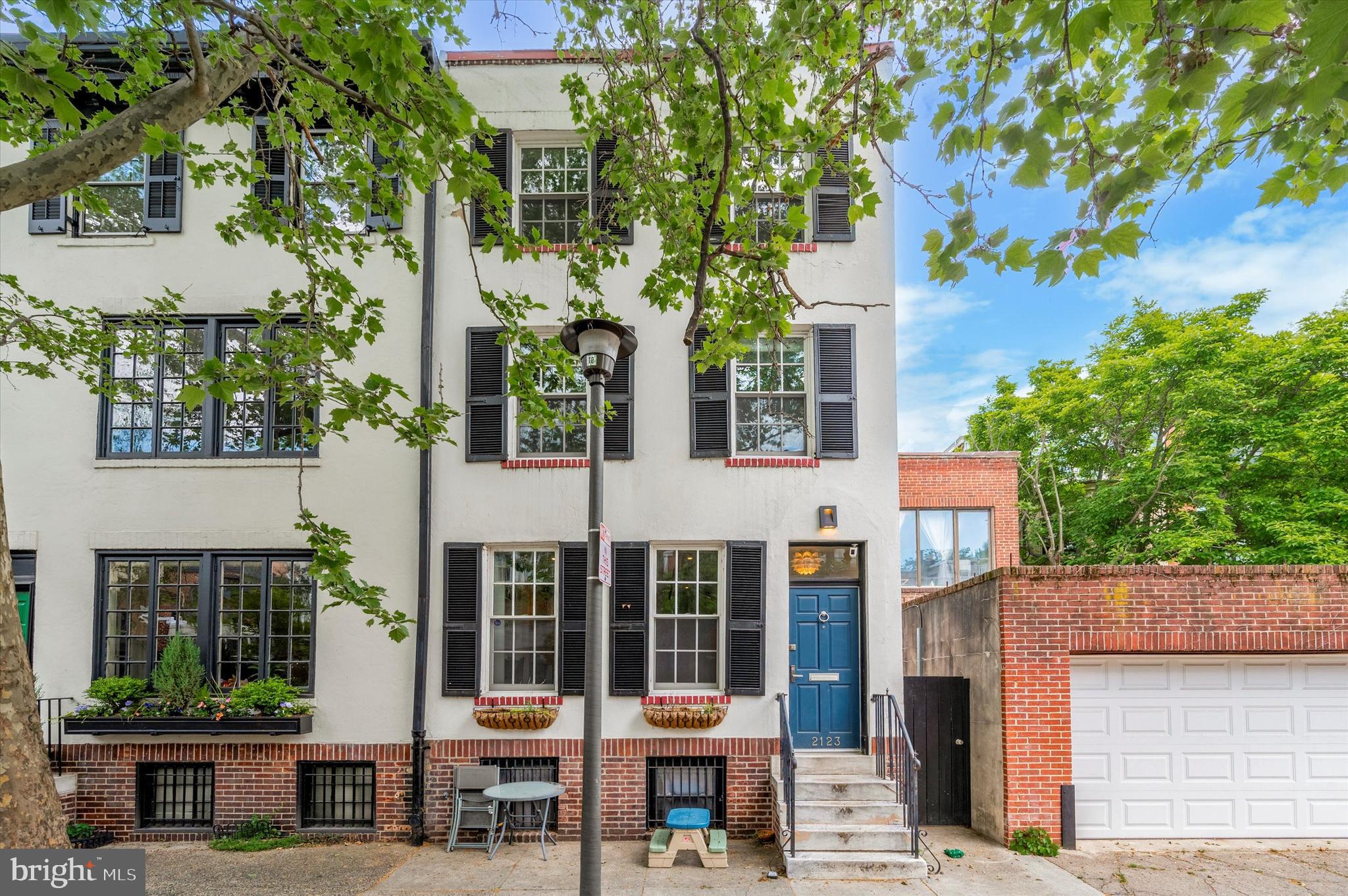 Step into the enchanting charm of this historic 4-bedroom, 2.5-bath home nestled on a quiet, tree-lined street in Rittenhouse Square. Built in 1900, this elegant residence blends original architectural details with thoughtful modern updates, offering timeless sophistication and comfort. As you enter, beautiful wood floors lead you through spacious, light-filled living areas. The updated kitchen is a chef’s dream, featuring sleek countertops, stainless steel appliances, and ample storage—all bathed in natural light from oversized windows. Fireplaces throughout the home add warmth and character to each room. Upstairs, each bedroom offers generous space and serene ambiance. The primary suite serves as a true retreat, perfect for unwinding at the end of the day. The partially finished basement includes a half bath, laundry area, and flexible space ideal for a media room, gym, or home office. Enjoy private outdoor space on the first floor, perfect for al fresco dining or relaxing in the fresh air. Located in the coveted Greenfield School catchment, this home is just a short stroll to Rittenhouse Park, top-rated dining, boutique shopping on Walnut and Chestnut Streets, and all the culture and convenience Center City has to offer.