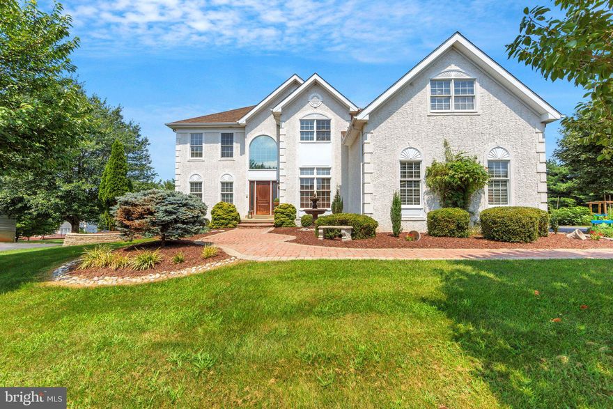 Welcome to 14 Cherrydale Rd, the ideal residence you've been dreaming of! Located in highly desirable Cobblestones at Thornbury, this beautiful property showcases the largest model on a premium lot. It offers panoramic views of open space and is conveniently located within walking distance to community amenities. This remarkable home, spanning approximately 5,000 sq ft, includes 4 bedrooms, 3.5 baths, and has been meticulously updated!  As you arrive, the immaculate curb appeal captivates you while a large driveway and custom pavers lead to the beautiful front door. Step into a grand 2-story foyer with a stately turned staircase and gorgeous, refinished hardwood floors. To your left, discover a bright living room that opens to an elegant dining room adorned with crown moldings and custom trim. To the right, a private home office boasts extensive built-in cabinetry. At the heart of this home is the remodeled chef's kitchen with extra-large cabinets, exquisite countertops, a subway tile backsplash, and stainless steel appliances. It features an oversized built-in refrigerator, a gas stove with custom range hood, a trash compactor, a generous center island with built-in shelving and a large walk-in pantry. The adjacent dining area opens to a huge, low-maintenance deck with stairs leading down to the impressive backyard. The kitchen seamlessly flows into a spacious, two-story family room, highlighted by a striking stone fireplace, large windows and a convenient rear staircase. A beautifully remodeled mudroom, equipped with a sink, beverage fridge, and perfect storage solutions, connects to a 3-car-sized garage. The garage boasts an electric vehicle charging station, two garage doors, and a side door leading to a workshop area. Ascend the beautiful hardwood stairs, adorned with a wood and wrought iron railing and elegant wainscoting, to reach the expansive primary bedroom suite. This sanctuary features a tray ceiling, integrated sound system, ceiling fan, and a fabulous windowed custom walk-in closet. The primary en suite bathroom includes an oversized vanity with dual sinks, a jacuzzi tub, and a separate shower. Convenience is key with the outstanding adjoining laundry room, offering attractive cabinetry, a folding area, drying racks, and a stylish barn door. The second level is completed by 3 additional bedrooms, each with ceiling fans, and a hall bath featuring dual sinks and a tub shower. The finished walk-out basement features luxury plank flooring and recessed lighting throughout. It includes a spacious recreation area, as well as a cozy wet bar. Two additional rooms, currently utilized as a playroom and exercise room, offer flexibility and could easily be transformed into a second home office or an in-law/nanny suite, complete with a full bathroom and lots of storage areas. The living space extends outdoors to a spectacular covered patio, which boasts a stunning stone fireplace. The patio is enhanced by custom lighting, wood storage, and a potting area. The expansive, level back and side yards provide privacy and open space for family enjoyment, featuring raised garden beds. Additional upgrades throughout the home include fresh paint, a newer roof, hot water heater and carpets, automatic turn on lights, new fans and oiled bronze door hardware. Cobblestones at Thornbury is a vibrant community offering a wealth of amenities, including a gated, heated pool with lifeguards, complete with bathrooms, showers and grills. Residents can enjoy tennis and pickleball courts, a scenic walking path, well-lit sidewalks, wide roads, and a host of community events throughout the year. The neighborhood also features a pond for fishing and ice skating, adding to its charm. Nestled in historic Thornbury Township, which is known for its parks, farmers market and dedication to preserving open space, it is also part of the award winning West Chester School District. You will be so thrilled to call this home. Schedule your private tour today.