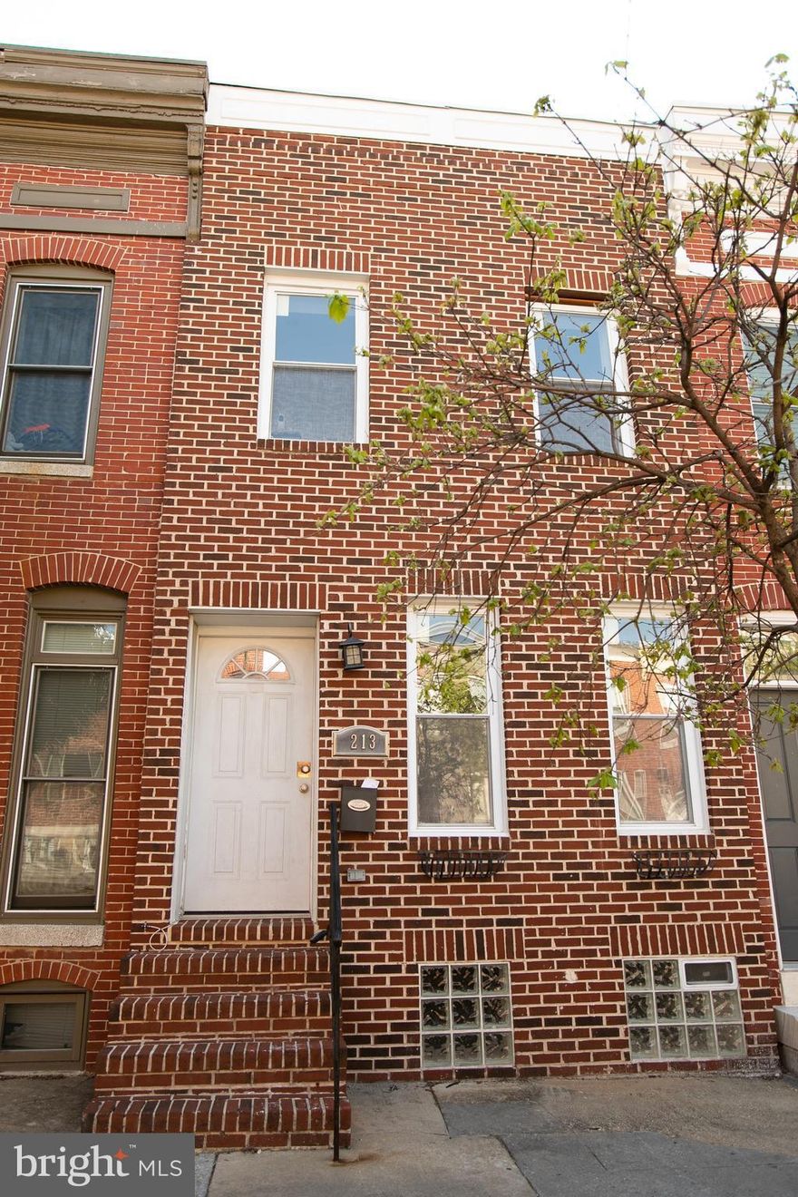 Renovated Patterson Park Rowhome. Wood floors thruout main, open stairs, exposed brick,  windows, vaulted ceilings w/ recessed lighting. Gourmet kitchen w/ granite counters, SS appliances, breakfast bar - perfect for entertaining! 2 Bedrooms w/ private full baths & fully finished basement w/ half bath and laundry. Large back patio, potential for parking!