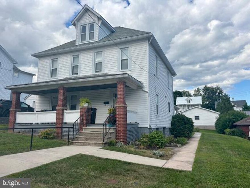 Beauty and Charm is what this home has to offer! With 4 bedrooms and 2 full baths this is a perfect , spacious, Family Home.  Upon entering, the first thing you will notice is the beautiful hard wood floors and wood staircase.  The upper level  has 3 bedrooms,  a full bath and laundry while the additional bedroom is on the main level with another full bath and kitchenette.  This is perfect for a master suite or guest quarters.   Off street parking includes a large 2 car garage with a walkway to the back entry.   Chairlift on the back porch for ADA accessibility.  Many improvements include some new appliances, carpet,  bathroom floors, double vanity, sinks & faucets, ceiling fans, electrical service, chimney repointed with a stainless steel liner, walkway lighting with motion sensors,  just to name a few.  The covered front porch is the perfect  retreat for morning wake ups and evening  unwinds.  This home is an absolute must see. Call to schedule your tour and settle in to enjoy the soon to be summer days and evenings .