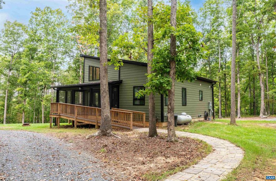 This 2-bed 2-bath, 1,014-FIN SQ FT CONTEMPORARY STYLE WATERFRONT OASIS was NEWLY BUILT IN 2022 and sits beautifully on 5 PARTLY-WOODED ACRES! Drop your kayak right from the house with roughly 600' OF LAKE ORANGE WATER-FRONT ACCESS! Enjoy the unlimited amount of storage space this home offers in the HEATED AND COOLED 507-SQ FT ATTIC! Prepare meals in the light-filled EAT-IN KITCHEN with gorgeous quartz countertops, stainless steel appliances, and white custom cabinetry or grill out on the SUNNY BACK TREX DECK! Take in the breeze within the SCREENED-IN FRONT PORCH or rest easy in the spacious FIRST FLOOR PRIMARY BEDROOM with walk-in closet and neighboring full bath! Cozy up next to the Great Room WOOD-BURNING STOVE in the winter while taking in dreamy WATER VIEWS from the couch and enjoy on-demand hot water via the TANKLESS HOT WATER HEATER! Store your yard tools within the SPACIOUS SHED with EV charger hookup and BUILT-IN WORKSHOP and enjoy the peace and ease of mind that living on a CUL-DE-SAC with NO HOA offers! Located within just 10-min from the town of Orange, 30-min from Lake Anna, and 45-50-min from Charlottesville! As an additional bonus, this home is handicapped accessible! Open House SUNDAY 10/1 12-2PM!,Quartz Counter,White Cabinets,Fireplace in Great Room,Fireplace in Living Room