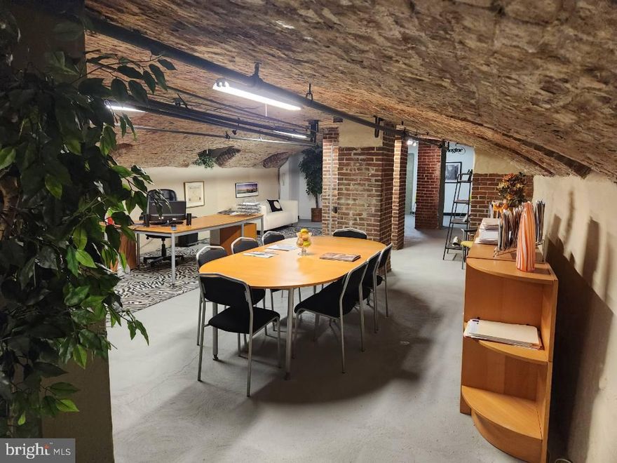 Envision running your business in a modern, organic, aesthetically delightful space in one of Philadelphia's busiest locations: Old City!  Enter through sliding barn door & wander under the vaulted brick ceiling through a wide space with an open floor plan and powder room.  Eye-catching arches throughout, exposed brick, fresh paint, and finished walls and flooring make this unique, raw commercial space in Old City's historic Malt House so appealing!  Also includes a kitchenette with stainless steel refrigerator, basin and counters, cabinets and bright lighting. Condo fees are just $255/month and  the taxes are reasonable too. The possibilities are endless: an artist's studio, salon, architect's workspace, wine cellar, office with conference room and ample desk areas, etc.  Perfect for inexpensive storage for any business in Old City. With a Walk Score  of 95 and diverse businesses all around, you will enjoy the best of Philly at your fingertips and customers at your door. Check out our YouTube tour,  simply search "Malt house Condo". Property is available for a lease for $995/month. 2 year lease minimum.