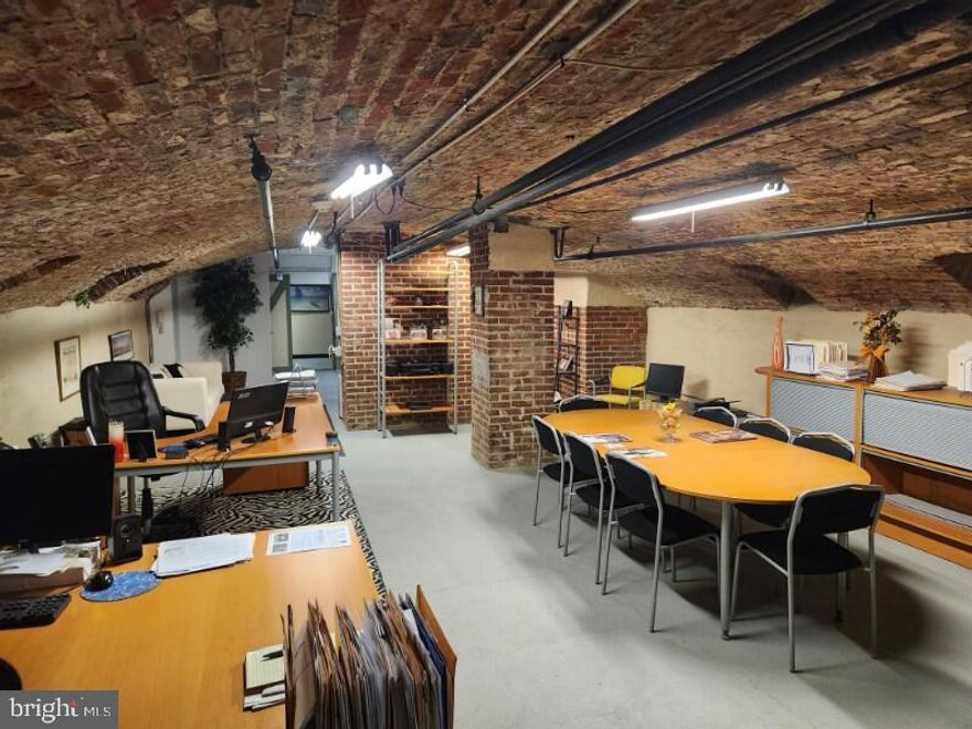 Envision running your business in a modern, organic, aesthetically delightful space in one of Philadelphia's busiest locations: Old City!  Enter through sliding barn door & wander under the vaulted brick ceiling through a wide space with an open floor plan and powder room.  Eye-catching arches throughout, exposed brick, fresh paint, and finished walls and flooring make this unique, raw commercial space in Old City's historic Malt House so appealing!  Also includes a kitchenette with stainless steel refrigerator, basin and counters, cabinets and bright lighting. Condo fees are just $255/month and  the taxes are reasonable too. The possibilities are endless: an artist's studio, salon, architect's workspace, wine cellar, office with conference room and ample desk areas, etc.  Perfect for inexpensive storage for any business in Old City. With a Walk Score  of 95 and diverse businesses all around, you will enjoy the best of Philly at your fingertips and customers at your door. Check out our YouTube tour,  simply search "Malt house Condo". Property is available for a lease for $995/month. 2 year lease minimum.