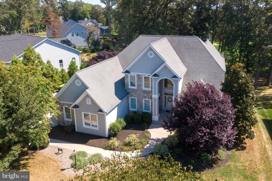 Discover an impressive and tastefully renovated .58‑acre pond‑front custom home in the well‑established Wagamons West Shores community in Milton, Delaware. This beautifully updated residence has been completely remodeled with brand‑new carpeting and premium upgrades throughout. The expansive two‑story layout offers six bedrooms and three and a half baths beginning with a grand entrance that opens into a bright open floor plan enhanced by new luxury engineered hardwood and tile flooring, a welcoming fireplace and a stunning four‑season room that leads to a spacious first‑floor balcony overlooking Wagamons Pond. The home features a completely redesigned upscale gourmet kitchen with striking quartz countertops, brand‑new stainless steel appliances, an elegant formal dining room and a stylish dry/wet bar ideal for entertaining. The first‑floor primary suite provides a private retreat with direct access to the rear balcony, a second fireplace, dual vanities, his‑and‑hers walk‑in closets, a sunken jetted tub and a walk‑in surround shower. The second floor offers five generously sized bedrooms all with new carpeting along with two Jack‑and‑Jill bathrooms and an additional balcony that captures elevated views of the pond. An oversized garage accommodates large vehicles with ease and the extended driveway provides ample parking for residents and guests. With very low HOA fees and a location in a quiet established community in the historic town of Milton—just minutes from beaches, restaurants, and shopping—this fully renovated home presents a rare opportunity to enjoy luxurious pond‑front living in a truly exceptional setting. Don't miss this fantastic opportunity.