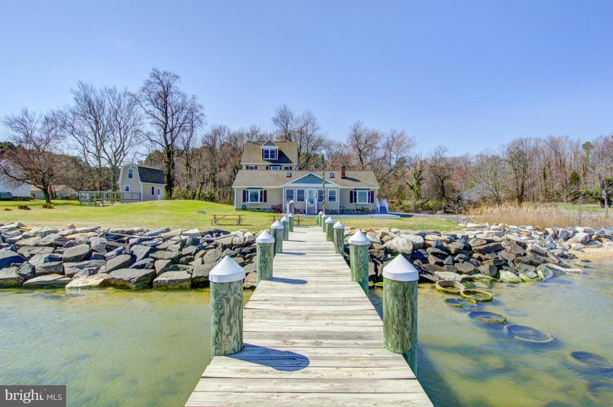 GORGEOUS & STUNNING! Amazing views of the water throughout! 3 BR 3 BA "main" house with gourmet kitchen AND 2BR 1BA apartment w/kitchen & great room above 2 car attached garage. From fishing or crabbing off the 190' private pier w/boat & jet ski lift, grilling in the backyard or relaxing on the private sandy beach, life doesn't get any better. Updated and upgrade from the inside out No HOA!