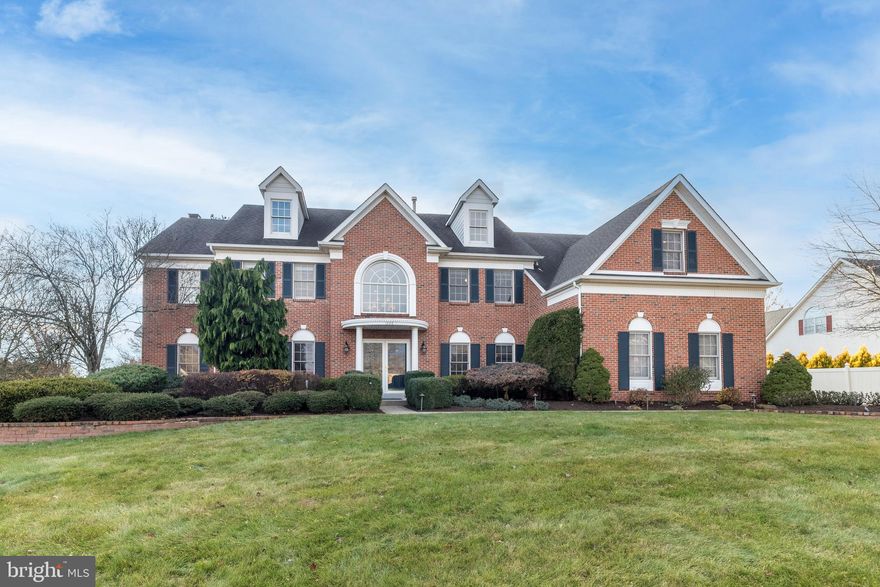 Enjoy Easy Living in this Excellent 5-bedroom, 5 bath Colonial with brick and newer Hardi-plank exterior (2017) and over 4300 sq ft plus Finished Basement situated on a gorgeous, fenced one acre lot with fantastic curb appeal in the highly desirable Ridings of Horsham, within walking distance of Horsham Park and Walking Trails. Step inside the freshly painted, neutral interior to experience the open floor plan seamlessly connecting the 1st floor living spaces, providing a harmonious flow throughout the home. The 1st floor features hardwood floors, custom millwork and 9’ceilings, plus two 2nd floor balconies overlook the first floor. The welcoming 2-story Entrance Hall opens to both the Living and Dining Rooms and includes the 1st of 2 staircases to the 2nd floor. Work from home in the sun-filled Office connected by double doors to the Living Room. The lovely formal Dining Room with crown molding and chair rail includes wall sconces. The heart of the home is the terrific Kitchen with center island with seating for 3 and 2 pendant lights above, and the perimeter with corian counters, double, self-cleaning wall ovens, dishwasher, double sink with garbage disposal, tiled backsplash, 42” cabinets and gas stove. The kitchen is open to the exciting 2-story Breakfast Room as well as to the connecting Family Room. The Breakfast Room offers a wall of windows with dramatic atrium window above, a built-in hutch/buffet/bar with granite counter and glass cabinets, perfect for entertaining, and a sliding door to the rear Patio. Relax in the connecting Family Room with 3 stunning windows, each with their own atrium window above, as the firewood crackles in the wood-burning fireplace with marble surround, marble hearth and wood mantel, providing extra ambiance and warmth. You will love the Mud Room with cubbies and cabinets, connected to the spacious Laundry Room with included washer and dryer, folding areas, custom shelving and a 2nd door providing access to the rear Patio. The 2nd floor, with hardwood flooring in the hall, offers an amazing Main Bedroom Suite featuring a Bedroom with tray ceiling, included wall-mounted TV, connecting Sitting Room with tray ceiling, 2 walk-in closets, linen closet and a renovated Main Bath (2011) with granite counters, double porcelain sinks, vaulted ceiling with skylight, soaking tub and spa shower with tiled surround, bench seat, body jets and frameless glass door. A 2nd bedroom includes an En-Suite Bath.  Bedrooms 3 and 4 connect to a Jack and Jill full bath with an additional door to the Hall, providing access for Bedroom 5. So much more fun awaits in the Finished Basement (added in 2011 and freshly painted and carpeted in 2022) with approx. 1100 additional sq. ft. There are connecting Recreation & Game Rooms w/wet bar, wine fridge, granite counter & glass cabinets, as well as a finished Bonus Room, perfect for a 2nd Home Office, as well as a Half Bath, plus. 2 wall-mounted TVs are included. Bilco doors open to the exterior. Extra interior features include a security system, new Generator (2022), speakers in many rooms and 2 zones of HVAC. One of the most wonderful features of this special home is the fenced rear yard. A gorgeous flagstone Patio overlooks the terrific grounds surrounded by professional landscaping. A newer Sports Court (2019) offers a Basketball Hoop and is designed for both a high net for volleyball and a low net. This excellent location is close to major routes including 309, 202 and the PA turnpike, as well as to Trader Joe’s, Costco, Wegmans and Whole Foods. Come make this House your Home.