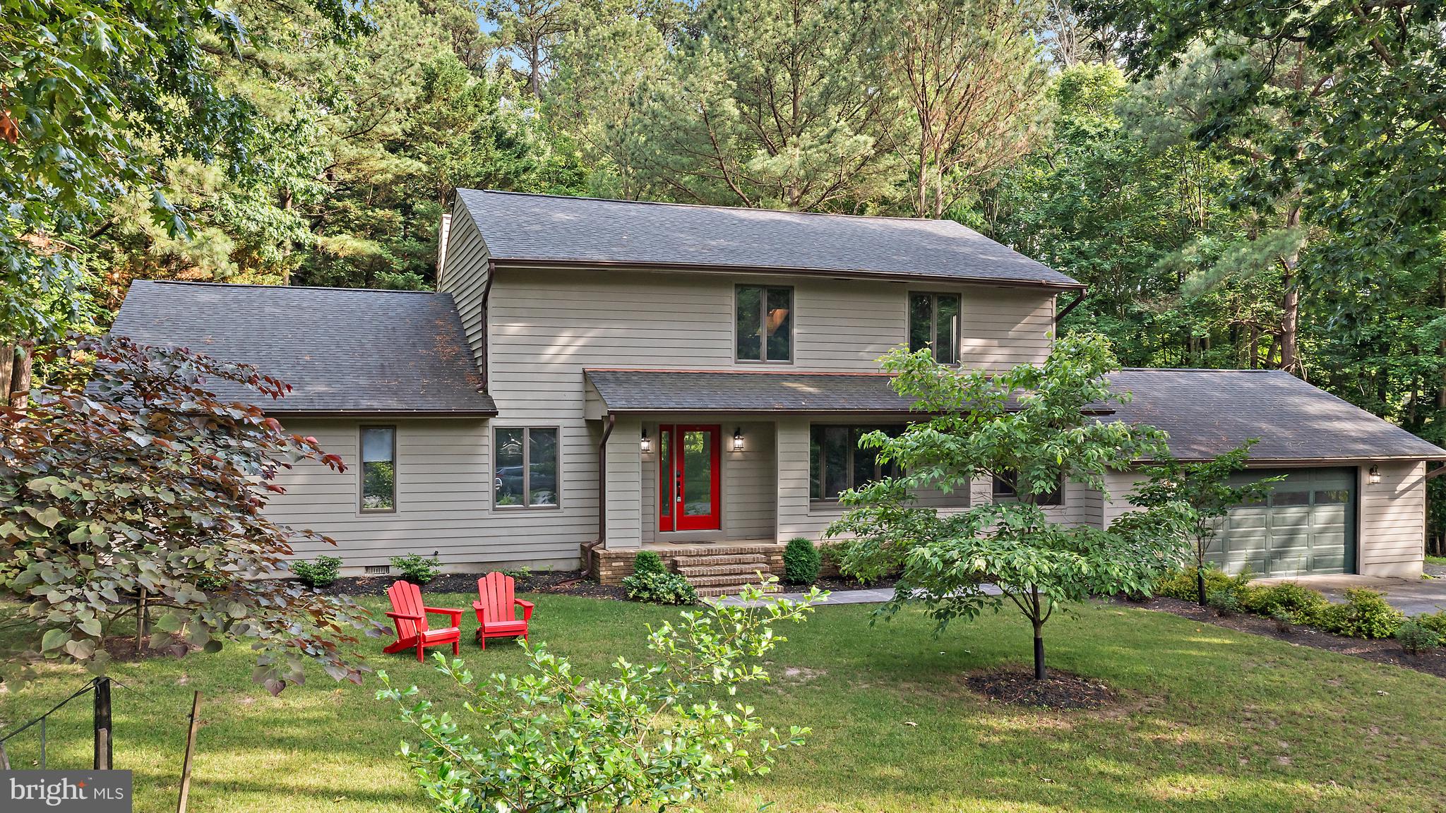 Enjoy a waterfront country club lifestyle with the privacy of wooded views at 4 Bunkers Court! This beautifully updated and private creek front home is tucked away on a wooded 1.53 acre cul-de-sac lot at the top of Little Greenwood Creek in the sought after waterfront golf course community of Prospect Bay. From soaring vaulted ceilings to thoughtful upgrades throughout, this home combines comfort, style, and space indoors and out.
Step inside to a welcoming foyer and formal dining room with updated lighting. The showstopper of the home is the stunning family room featuring vaulted wood planked ceilings and a striking stone fireplace, an architectural focal point that adds warmth and character.
The updated kitchen is a chef's delight with new stainless steel Frigidaire Gallery appliances, granite countertops, freshly installed tile backsplash, new flooring, and a sleek hood vent. A cozy breakfast nook with custom built-ins offers extra storage and bar countertop seating.
Just off the kitchen, you’ll find a new mudroom and laundry area with two additional storage closets and a newly added powder room, all connecting to the oversized two-car garage for everyday convenience.
The main level offers three bedrooms and two full bathrooms, including a serene primary suite with private patio access, two closets, and a fully updated en suite featuring a walk-in glass enclosed shower with overhead and wall mounted shower heads, and a double vanity with modern finishes.
Upstairs, a spiral staircase leads to a spacious and versatile loft ideal as a fourth bedroom, office, or entertaining space. This grand loft includes a game and TV area, pool table, new full bathroom with designer tile and a glass shower door, and a custom-built bar area with a beverage fridge, microwave, sink, cabinetry, and backsplash perfect for hosting guests in style.
Outside, step onto your private bluestone patio and hot tub, surrounded by the natural beauty of your wooded lot. The sellers have explored the potential of building a boardwalk to the creek with a floating dock buyers to verify offering exciting possibilities for enjoying the waterfront setting.
Living in Prospect Bay means more than just a beautiful home, it’s a lifestyle. Enjoy first class amenities including a championship 18 hole golf course, tennis and pickleball courts, outdoor pool, clubhouse with dining, social events, boat basin, and more.
Whether you're hosting in the open concept living spaces, relaxing in your upstairs retreat, or soaking in the serenity of your private wooded backyard, 4 Bunkers Court is the perfect place to call home!