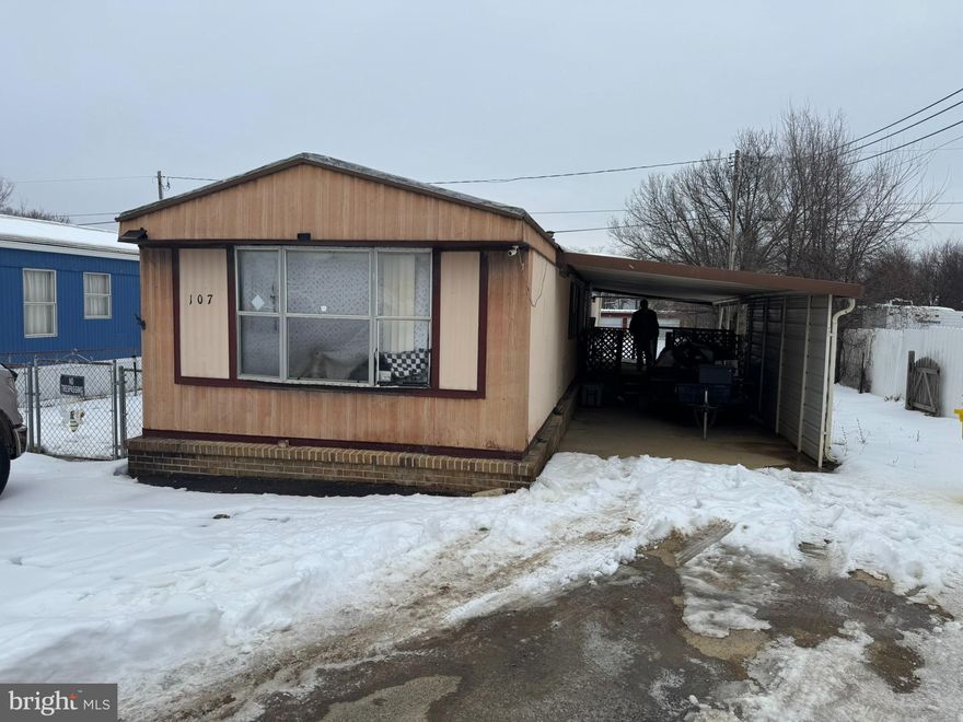 Perfect for an investor or first time buyer! This home is not on a rented lot. It has just over a 1/4 acre lot included in the purchase. There is a carport to keep your covered from the weather. Inside there is a spacious living room with lots of windows. It is open to your large kitchen. This is a great set up if you like to entertain. The laundry room keeps your front load washer and dryer tucked away. Down the hall you have a large bedroom with carpet and overhead light. The hall bath features an extended single bowl vanity and tub/shower. The primary suite features a large bedroom with carpet and overhead light. Your private primary ensuite includes an extended single bowl vanity with tub/shower combo. Schedule your showing today!