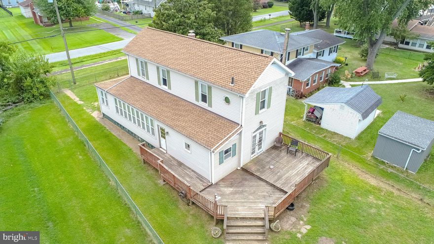 An incredible opportunity awaits in this quiet, water-oriented neighborhood in Sparrows Point. The renovation began as a labor of love, but life happened, and seller is unable to complete. This is your chance to bring your vision and restore this home to its former glory. Great bones, open layout, large rooms, tall ceilings, fantastic location and an amazing 24Wx32Lx15H garage/pole barn building with electric, double thick concrete floors, full bath rough in, mini split unit and pellet stove. A contractor or business owner’s dream! Or maybe in-law/auxiliary dwelling unit? Gym? Studio? You decide! Step outside the house to an expansive deck overlooking your large, level fenced lot with private driveway. Nestled in a community brimming with small-town charm, this home perfectly balances peaceful living with everyday convenience. Enjoy nearby waterfront parks, marinas, local restaurants, and quick access to 695, 95, BWI Airport, Canton, Downtown Baltimore, Tradepoint Atlantic, Hopkins and world-class healthcare. From festive holiday tree lightings to the beloved annual Fireman’s Carnival, this welcoming neighborhood truly feels like home. Renovated homes have sold over 600k. The potential is unlimited! Make your appointment today!
