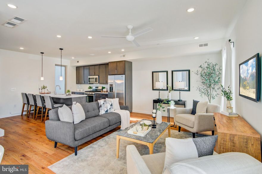 ***Offering $5,000 in Sellers Assistance***Use toward Closing Cost or buy down your interest rate. Real Estate Taxes only $688/year!
Welcome to Kensington Courts, an energetic community in the heart of East Kensington/Fishtown, with 2 CAR PARKING!!!
This 6 year young 3-bedroom, 3.5-bath corner home boasts beautiful hardwood flooring throughout, a bright open layout, and sleek finishes.  The main level flows  seamlessly from one room to the next, a gourmet kitchen featuring Quartz countertops, stainless steel appliances, and ample storage from 42 inch cabinetry.  Then to a spacious living and dining area, complete with a powder room and pantry closet. Upstairs, you’ll find three bedrooms with three full baths, two of these are en suites.  If you are looking for closet space, this is the home for you! The primary suite offers a gigantic walk in closet, a standard closet, and a linen closet in the bathroom.  The spacious laundry room completes this floor with a high-efficiency (HE) front-load washer and dryer.  The top floor offers the second ensuite, which includes another spacious walk-in closet and a private bathroom.  The third bedroom can be used as an office or guest bedroom and has its own hall bathroom.  Venture up to the roof deck, a highlight of this home! Offering unobstructed panoramic views of the Philadelphia skyline—perfect for entertaining or relaxing.  Located just steps from the best of city living, you’re within 10minutes of major highways (I-95, I-676), public transportation(El/Market-Frankford Line), and some of Philly’s most iconic neighborhoods. Explore green spaces like Penn Treaty Park, or take advantage of fitness / yoga studios and gyms close by, and enjoy renowned restaurants, like Suraya, or coffee shops, like La Colombe, and the many breweries along Frankford Avenue and in nearby Fishtown. With Northern Liberties, OldCity, and Center City just minutes away, this home places you at the center of it all—offering the ultimate blend of lifestyle, comfort, and convenience.  Seller is a licensed real estate agent.