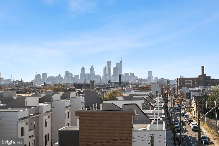 Welcome to Kensington Courts, an energetic community in the heart of East Kensington/Fishtown! 
This 6 year young 3-bedroom, 3.5-bath corner home boasts beautiful hardwood flooring throughout, a bright open layout, and sleek finishes.  The main level flows  seamlessly from one room to the next, a gourmet kitchen featuring Quartz countertops, stainless steel appliances, and ample storage from 42 inche cabnetry.  Then to a spacious living and dining area, complete with a powder room and pantry closet. Upstairs, you’ll findthree bedrooms with three full baths, two of these are ensuites.  If you are looking for closet space, this is the home for you! The primary suite offers a gigantic walk in closet, a standard closet, and a linen closet in the bathroom.  The spacious laundry room completes this floor with a high-efficiency (HE) front-load washer and dryer.  The top floor offers the second ensuite, which includes another spacious walk-in closet and a private bathroom.  The third bedroom can be used as an office or guest bedroom and has its own hall bathroom.  Venture up to the roof deck, a highlight of this home! Offering unobstructed panoramic views of the Philadelphia skyline—perfect for entertaining orrelaxing.  Located just steps from the best of city living, you’re within 10minutes of major highways (I-95, I-676), public transportation(El/Market-Frankford Line), and some of Philly’s most iconic neighborhoods. Explore green spaces like Penn Treaty Park, or take advantage of fitness / yoga studios and gyms close by, and enjoy renowned restaurants, like Suraya, or coffee shops, like La Colombe, and the many breweries along Frankford Avenue and in nearby Fishtown. With Northern Liberties, OldCity, and Center City just minutes away, this home places you at the center of it all—offering the ultimate blend of lifestyle, comfort, and convenience.  Seller is a licensed real estate agent.