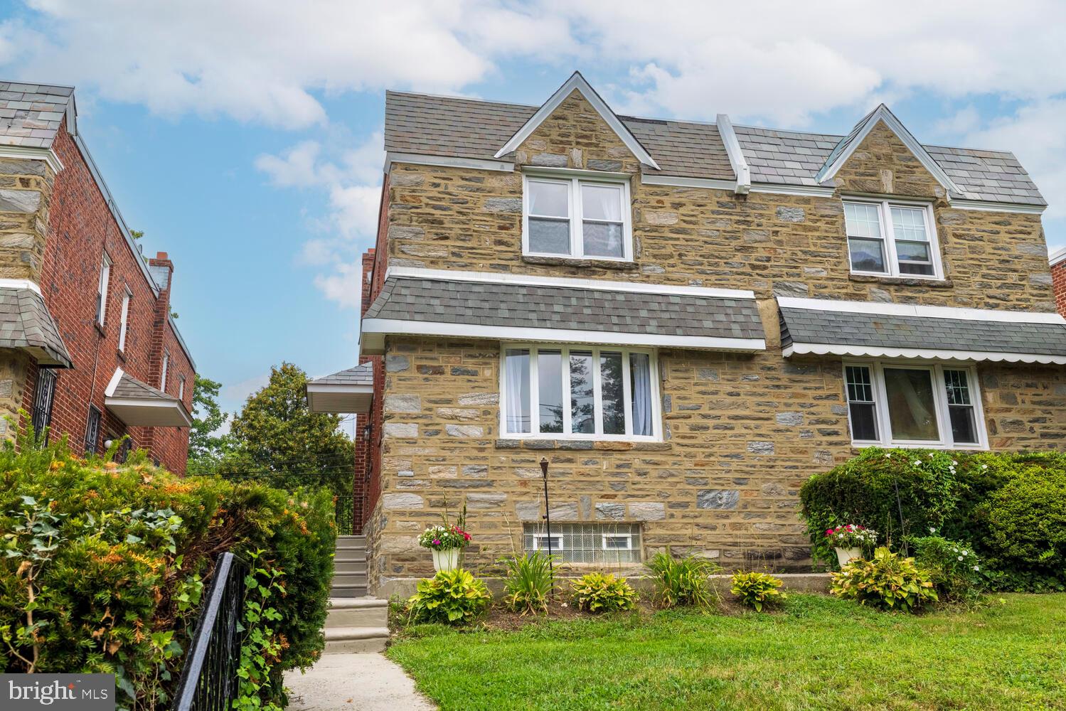 Beautifully renovated 4BR/3.5BA twin in Mt. Airy featuring the updates and flexible space you want. Bright main level flows to a modern kitchen with gas cooking, dishwasher and great storage. The living room features an LED fireplace with heating function—instant coziness for movie nights. Upstairs, the second floor offers three nicely sized bedrooms with ample closets, a refreshed hall bath, and a comfortable primary suite with its own bath. A finished lower level (basement) adds true versatility with a full bath, kitchenette and living space anchored by a second LED fireplace (with heat)—perfect as a bedroom suite, guest/bonus space, office, gym, or media room. Also enjoy easy outdoor entertaining with a welcoming front patio, a rear deck off the main level, and a private rear yard—room to grill, garden, and gather. System and utility upgrades include efficient gas hot-air heat, brand-new central A/C, new 30-gal gas hot water heater, and 100-amp electric breakers. Attached 1-car garage for secure parking/storage. Convenient Mt. Airy location close to neighborhood shops, dining, parks, and public transportation. Come see the light, the layout, and the lifestyle—tour today! **Some pictures have been virtually staged