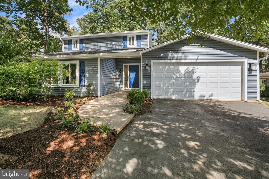 Beautifully Renovated and Move-in Ready!!! Modern Single Family home in the lovely Hiddenbrook neighborhood of Herndon. The main level offers a spacious open floor plan with a formal living room at the front of the house with large windows and vaulted ceilings, plus a formal dining space off the kitchen. The kitchen is the heart of this home with beautiful white & gray cabinetry, sleek black hardware, quartz countertops, and farmhouse-style backsplash, light fixtures, and oversized sink. Stainless steel appliances featuring a range hood and pot filler over the stove. You'll love to entertain at the large island with breakfast bar seating and the custom wet bar features a wine rack and kegerator! The kitchen opens up to the cozy family room with a wood-burning fireplace to enjoy this season. Heatilator conveys and helps circulate the hot air throughout the space. Laundry room, coat closet, and powder room on the main level. Upstairs, your primary bedroom offers an updated en-suite bathroom with a custom double vanity with quartz countertops, stylish tiled floors, shower with glass enclosure, and a walk-in closet. 3 additional bedrooms with lots of natural light. The hallway closet offers additional storage, and the hall bathroom is newly renovated with a tiled floor and shower surround, new tub, vanity, and fixtures. The home was updated with ALL NEW Roof, Siding, Windows, and Doors in 2022!! New HVAC (Heat Pump & Condenser), Tankless Hot water heater, and Luxury Vinyl plank flooring installed in 2019! Enjoy a newly landscaped entrance and a backyard patio for relaxing and entertaining. Large corner lot (0.28 Acre). Walk to the neighborhood trail and pond, community club house with playground, tennis courts, and pool. 5 minute drive to downtown Herndon restaurants, 10 minutes to Reston Town Center and tons of nearby entertainment, shops and restaurants! 15 minutes to Dulles Airport. 30 minutes to DC. Don't miss out on this gorgeous home completely updated from top to bottom! Schedule your tour today! OFFER DEADLINE SUNDAY 9/10 at 8pm!!