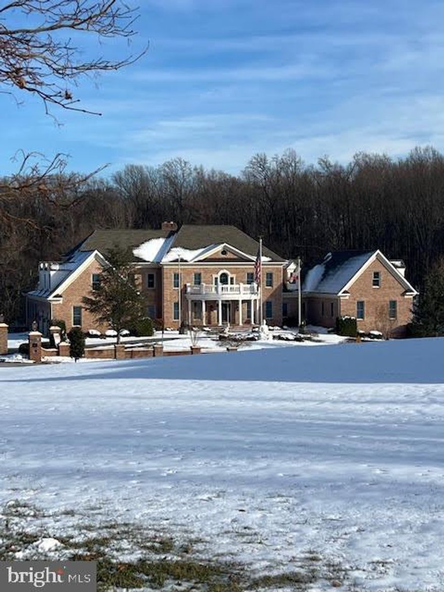 An extraordinary estate offering over 12,600 square feet of masterfully finished living space, designed for those who demand scale, privacy, and uncompromising quality.

This 5-bedroom, 6 full bath residence features two luxurious primary suites, including a first-floor suite with private sitting room,  ideal for multigenerational living or distinguished guest accommodations. Every bedroom offers a walk-in closet and private ensuite. The dramatic great room with coffered ceilings and expansive windows anchors the home, while dual staircases add architectural elegance and flow.

The gourmet kitchen is appointed with Wood-Mode cabinetry, Wolf and Sub-Zero appliances, and a butler’s pantry, seamlessly connecting to formal entertaining spaces, a sunroom, and a sunken family room with fireplace. Waterford crystal chandeliers, custom millwork, built-ins, and three fireplaces elevate the interiors throughout.

The walk-out lower level is exceptional in both scale and finish, featuring soaring 10–12’ ceilings, imported marble flooring, a gas fireplace, full bath, and rough-ins for a future kitchen and additional living spaces,  offering limitless possibilities for extended living or recreation.

Engineered for long-term performance, the home includes geothermal heating and air with six vertical wells, three heat pumps, four-zone HVAC, 600-amp service, Andersen windows, a 2022 roof with transferable warranty, updated baths (2025), and fresh interior paint (2025). A three-level elevator, step-free garage entry, central vacuum, and intercom system enhance both luxury and livability.

Custom exterior lighting, low-maintenance landscaping, an approved brick privacy wall for future gates, and expansive driveway parking complete this rare offering within a highly desirable community with voluntary HOA.

A statement residence of extraordinary scale, infrastructure, and presence.