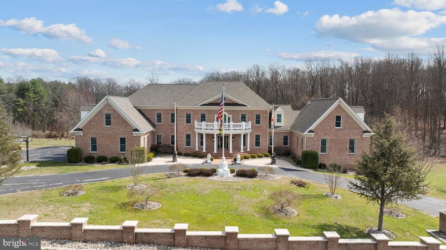 An extraordinary estate offering over 12,600 square feet of masterfully finished living space, designed for those who demand scale, privacy, and uncompromising quality.

This 5-bedroom, 7 full bath residence features two luxurious primary suites, including a first-floor suite with private sitting room,  ideal for multigenerational living or distinguished guest accommodations. Every bedroom offers a walk-in closet and private ensuite. The dramatic great room with coffered ceilings and expansive windows anchors the home, while dual staircases add architectural elegance and flow.

The gourmet kitchen is appointed with Wood-Mode cabinetry, Wolf and Sub-Zero appliances, and a butler’s pantry, seamlessly connecting to formal entertaining spaces, a sunroom, and a sunken family room with fireplace. Waterford crystal chandeliers, custom millwork, built-ins, and three fireplaces elevate the interiors throughout.

The walk-out lower level is exceptional in both scale and finish, featuring soaring 10–12’ ceilings, imported marble flooring, a gas fireplace, full bath, and rough-ins for a future kitchen and additional living spaces,  offering limitless possibilities for extended living or recreation.

Engineered for long-term performance, the home includes geothermal heating and air with six vertical wells, three heat pumps, four-zone HVAC, 600-amp service, Andersen windows, a 2022 roof with transferable warranty, updated baths (2025), and fresh interior paint (2025). A three-level elevator, step-free garage entry, central vacuum, and intercom system enhance both luxury and livability.

Custom exterior lighting, low-maintenance landscaping, an approved brick privacy wall for future gates, and expansive driveway parking complete this rare offering within a highly desirable community. 

A statement residence of extraordinary scale, infrastructure, and presence.  Don't forget to view the video tour!