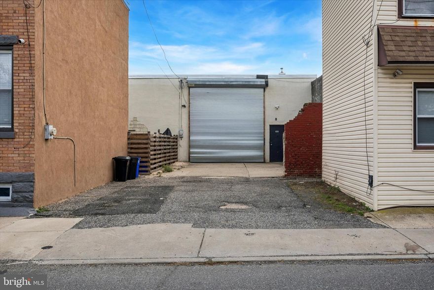 Unlock the potential of 3605 Salmon Street, a versatile commercial lease opportunity in the heart of Port Richmond—one of Philadelphia’s most rapidly evolving industrial-meets-creative corridors. This expansive property delivers the space, flexibility, and accessibility today’s businesses need to operate efficiently and scale with confidence. Step inside and take advantage of approximately 6,300/SF of interior space, featuring 14-foot ceilings and an open layout that accommodates a wide range of uses. From contractors, builders, and fabricators to architects, designers, and artists seeking studio or production space, this property adapts to your vision. The property boasts two separate driveways leading to individual garage bays, perfect for loading, receiving, vehicle access, or secure storage. These bays offer flexible leasing options: each bay can be leased individually for $3,500/month + NNN, or the entire space can be taken as a single unit for $7,000/month + NNN. Whether you need one dedicated workspace or the full property for a growing operation, the layout provides options to suit your business needs. Inside, elevated heating units keep the warehouse floor clear and usable, while a private office suite with heat and A/C provides a comfortable space for administrative tasks, meetings, or day-to-day management. A full bathroom is also included for added convenience. Set in Port Richmond, you’re surrounded by a mix of established trades, buzzing creative shops, and new businesses flocking to the neighborhood for its accessibility and industrial charm. Quick connections to I-95, Center City, and nearby riverfront corridors make this spot ideal for distribution, collaboration, and client access. 3605 Salmon Street gives your business room to build, create, store, or innovate—all in a location that keeps you connected and positioned for growth.