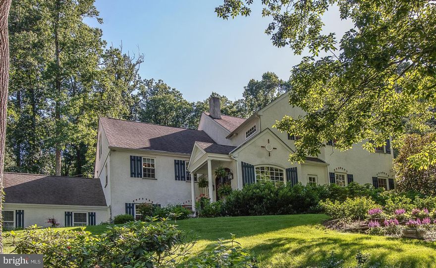 If you are looking for that exceptional and unexpected property in the award-winning Tredyffrin Easttown School District, this home is for you.  As you enter through the beautiful wood-stained and glass double doors, you immediately feel as if you have stepped into a home tucked into the hills of the French countryside.  Offering distinctive architectural features and designer touches throughout with a seamless welcoming flair.  The bright & spacious open layout of the main floor with the fabulous Living Area features a full custom stone fireplace wall, exposed wood beams, & an exquisite Dining Area with hidden bar and concealed storage.  Chef’s may only dream about this most amazing Gourmet Kitchen with an oversized 10+ ft Quartz center island, stunning custom cabinetry, high-end professional grade appliances, dual dishwashers, unique storage, a side bar serving area and twin double French doors opening to a beautifully landscaped and picturesque garden flagstone Patio.  The outdoor space is a private oasis unto itself, and blends beautifully with the warm & welcoming indoor Living area creating a wonderful indoor/outdoor flow for entertaining family and friends. 
Half a flight down from the main floor is the bright daylight Family Room, which is currently being used as an Office for a home-based business but could easily function as a kids play space with custom built-ins, Powder Room and door to the rear yard.  There is a large Mudroom for storage and access to the front walk-way and attached two-car Garage. 
On the upper levels you will find 5 Bedrooms and 4 Full Baths, all tastefully designed and updated.  The Primary Bedroom is a superior space, airy and bright, with its own Sitting Room/Exercise Area, a large walk-in closet and a spa-like Primary Bath, with gorgeous Carrara marble, double sinks, a private toilet room and a steam shower to rejuvenate you.  The additional 4 Bedrooms are roomy and inviting with 2 Bedrooms having their own en-suite Baths.  The Laundry Room is featured on the same level as the 5th Bedroom.  The large, finished Attic is cleverly designed as a kid space, great for hanging out with friends and having sleepovers.  It also features an unfinished space for additional storage.  
Great location with easy access to Devon Yards, downtown Wayne and Berwyn, Schools, R5 Train, as well as shopping and major highways.  Fabulously designed with an unparalleled feel combined with low annual taxes for a property of this style (below $9,500 per year), this home is sure to delight the most discriminating buyer.