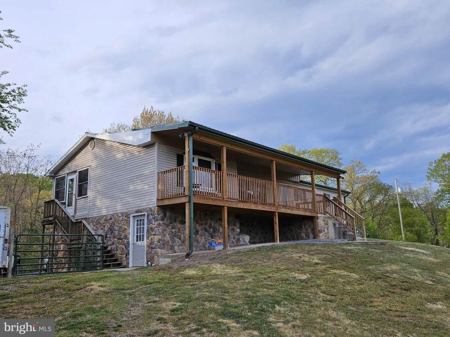 Quiet & low maintenance home with a covered front porch on 2.02 Acres. Offers a gorgeous country setting surrounded by spectacular views with close proximity to Dolly Sods, Canaan Valley Ski Resort, and Black Water Falls. 3 bedrooms and 2 baths. Metal roof and gutters installed in 2020.  20KW standby whole house Cummins Generator installed in 2014. Lots of storage.  Wired for ADT.  2 car garage. Would you like to plant a garden? This home offers a garden.  Two storage sheds and a pole building included.  Schedule a showing today. Located 2.5 hours from Washington, DC.