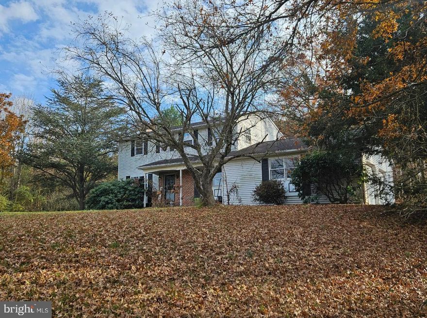 4 Bedroom colonial awaiting your finishing touches.  Freshly painted throughout with new flooring.  Main level features eat-in kitchen, laundry area, 1/2 bath, living room with fireplace and dining room.  Upstairs are 4 spacious bedrooms and 2 full baths.  Lower level is full sized basement waiting to be finished.  Property is a secluded flag lot with open space, trees and inground swimming pool.  Oversized garage and plenty of parking.