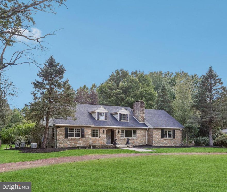 Spectacular 5 Bedroom Riverfront Home situated on 1.29 acres of scenic grounds with serene river views & 150 feet of river frontage! Also included in the sale is a secondary parcel of land - Tax ID 20-053-059 which is located on the other side of the road.  This river front property has endless possibilities such as a boat dock for easy access to the river and  comes complete with Riparian rights.  Backing to 50+ acres of protected land, this home offers a spacious interior with hardwood flooring throughout and 4 full baths! The living room is complimented with a large window with amazing river views & features a gorgeous stone propane fireplace and accent wall. Adjacent lies a formal dining room with ample space for a large dining room table and neighbors a completely renovated kitchen with a large center island, striking blue cabinetry, glass tiled backsplash, recessed lights, & beautiful views of the park-like setting from behind. Main level features 3 large size bedrooms, a study with fireplace, laundry room, and a magnificent sunroom with vaulted ceiling, 3 skylights and ceramic tile floors.  Main Bedroom on first level features a completely remodeled full bathroom with large shower stall enclosed in glass, double vanity with quartz counters, and ceramic tiled flooring, and a large Walk-in closet.  Second full bathroom on main level features a large shower stall, modern vanity, and shiny porcelain tiled flooring.  As you wander to the upstairs level another Main Bedroom awaits with an enormous En-suite bath with dual vanity with quartz counters, massive walk-in shower encased in glass, modern standup tub, and gleaming porcelain tiled floor.  A fifth bedroom is also featured on the Second level, which could even be utilized as a nursery or office.  Walkout finished lower level features a fourth full bath with shower stall, laminate floors, and a secondary stone fireplace! Another great space for added guests, children's playroom, or area for entertainment.   A two-car garage is located behind with direct access to the lower level.  As you venture to the rear yard, you will be taken away by the gorgeous paver patio with stairs leading down to the EP Henry walkway and the stone firepit - a truly a beautiful place to entertain guests on those cool fall evenings!  Home also comes with brand new roof, newer furnace, and a full home generator.  This exquisite property is located in close proximity to all major throughways with accessibility to Philadelphia, Princeton, and New York.  Home is also situated in Pennsbury School District.