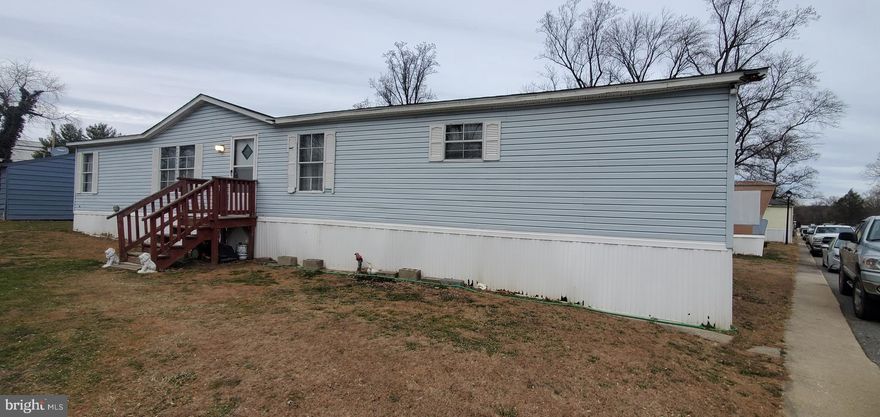 Attention !!  Here is your chance to own a double wide at the price of most singlewide homes.  Updates include flooring, kitchen and roof.  Three large bedrooms and two full bathrooms.  Spacious kitchen and living room.  Large utility room for washer and dryer.  All buyers must be park approved to purchase .  Schedule your personal tour today!