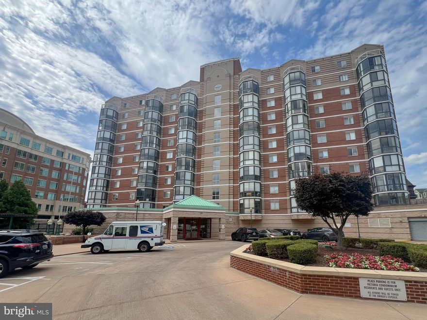 Introducing an exquisite urban abode nestled within The Victoria: a sprawling 1,460 square foot end unit penthouse, offering unparalleled panoramic views. Seldom available for sale, this former model home epitomizes convenience and elegance. Boasting 2 bedrooms and 2 bathrooms, this resplendent condo bathes in natural light, enhanced by two expansive balconies.
Recently revitalized with fresh flooring and a contemporary palette, the interior exudes a sense of airiness and sophistication. The open-plan living and dining areas seamlessly flow, ideal for both relaxation and entertainment. A culinary haven awaits in the fully renovated kitchen, complete with an inviting eat-in space which could also be a small office with French door separated from the living room..
Retreat to the luxurious master suite featuring a commodious walk-in closet with additional mirror door closets. A spa-like en suite bathroom replete with a sumptuous soaking tub, separate shower, and dual vanities. 
There is a generously proportioned second bedroom. This versatile space offers the flexibility to serve as an office or guest room, accommodating diverse lifestyle needs with ease. Whether utilized as an extra comfortable bedroom, productive workspace or a welcoming retreat for visitors, this well-appointed room adds functionality and comfort to the home. Added convenience comes in the form of in-unit laundry facilities in the second bathroom.
This urban oasis is further enriched by a two-zoned HVAC system and two secure underground parking spaces. Positioned in the heart of Rockville, residents enjoy unparalleled access to the vibrant Town Square, brimming with dining options, retail boutiques, cultural attractions and entertainments. Commuters will appreciate the proximity to the Rockville Metro, bus stop, and Marc Train, as well as easy access to I-270.
Included in the condo fee is a host of amenities such as water, hot water, access to the fitness room, HVAC maintenance and replacement, trash removal, and exterior upkeep. Notably, the special assessment has been settled, ensuring a hassle-free move-in experience.
Elevate your lifestyle with this move-in ready sanctuary, where urban convenience meets refined living. Schedule a visit to this stunning condo in an unbeatable location today!