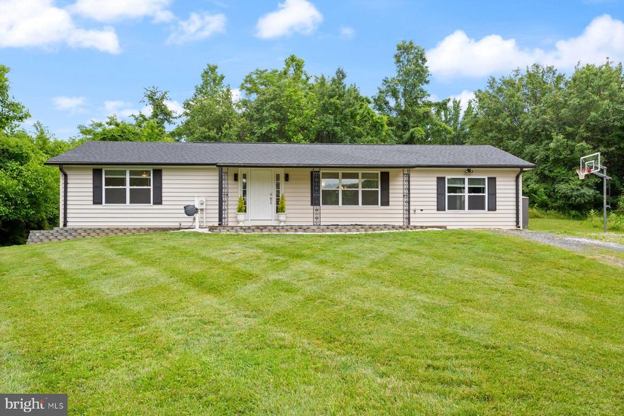 Fully updated and spacious 3 bed/2.5 bath rancher offering a new kitchen with white shaker cabinets/SS appliances/granite countertops/tiled backsplash, updated bathrooms and freshly refinished solid oak hardwood floors throughout!  There are two spacious bedrooms at one wing of the home with an oversized owners suite at the other end of the home  that offers a large walk in closet & on-suite bath.  The lower level is fully finished with a half bath and has access to the rear yard.  The home also features an energy efficient heat pump furnace w/propane backup (propane tank currently has been removed), all new double pane windows, a brand new roof, new ac and new siding with new exterior insulation & exterior thermal wrapping!  This is a nearly new home from inside to the exterior!