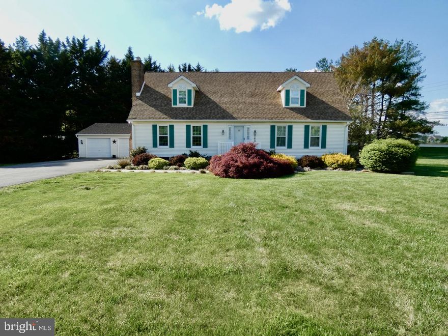 Looking for a home on a sizable piece of land?  This one could be just what you want!  A lovely 4 Br/3Ba Cape Cod style home with a custom Amish-built 2 car detached garage, low maintenance vinyl exterior, a dimensional roof &  mature landscaping that sits on an amazing 1.58 acre lot backing to trees & offering loads of space to make your own with so many possibilities! Your showing experience starts with the welcoming curb appeal of this corner lot property providing an extra long driveway to accommodate at least 6 cars and mature landscaping across the front of the house. Heading inside at the front door, the Foyer features HW floors, crown molding, a deep coat closet & HW staircase to the 2nd floor.  To the left is the formal Living Rm offering HW floors, crown molding, chair rail decor, 2 large windows for great natural light and a beautiful brick surround fireplace w/ pellet stove insert and blowers adding cozy heat through the main floor during those cold winter months! The oversized Kitchen provides both Kitchen & Dining space making both day to day or Hosting a breeze!  The Kitchen offers loads of great features including crown & chair rail moldings, HW & LVP flooring, lighted ceiling fan, SS appliances, recessed lighting, a penninsula counter with seating for at least 2, loads of cabinet storage and French doors that lead out to the 20x13 deck w/ an attached 11x9 Gazebo as well! For added convenience, the home's main floor Laundry Room is just behind the Kitchen near the side exit door. The private Laundry Rm offers plenty of space & includes Washer, Dryer, Laundry Sink, convenient shelving, a deep utility closet & a rear facing window for added light/fresh air!  The HW floors continue down the Hallway towards the main floor Bedrooms where you'll see a full Bath offering tub/shower combo, vanity sink & vinyl flooring.  The Primary Br features plush carpet, crown molding, lighted ceiling fan, great natural light, double closets & a full private bath w/ shower stall, vanity sink & window!  The 2nd Br on the main floor is a bit larger and also features plush carpeting, crown moldings, 2 double closets, lighted ceiling fan and multiple windows.  Heading upstairs, there are 2 large Bedrooms  offering lighted ceiling fans, crown molding, plenty of closet storage, great natural light & pull down stairs accessing the attic.  There's also a 3rd full bath on that level and a door at the top of the stairs for added privacy.  Looking for more future living space or added storage? The full unfinished basement provides loads of additional storage & features a French drain system, sump pump, utility area for HVAC & water heater, and walk-up stairs through the bilco doors leading out to the backyard which allows the new owner to obtain  necessary future permits to finish all or a part of the basement as well if desired!  This 1.58 acre lot has loads of charm, flowering trees, lush green lawn and beautiful views to enjoy from the spacious deck & Gazebo!  Get excited to enjoy the outdoors either relaxing under the Gazebo w/ a cool drink or entertaining family & friends on a beautiful day!  Location is super convenient to major routes 13/7 and Del Rt1 as well as Wrangle Hill Rd, so traveling in all directions is a breeze! Closeby to Shopping, Dining & Entertainment locations including Historic Delaware City & Historic New Castle each offering an abundance of river views, historic attractions, quaint eateries, open parkland, etc!  Additional highlights include 6 Panel Colonial Doors &  Crown molding throughout the home! Put this great home on your next tour!  See it! Love it! Buy it!....before someone else beats you to it!